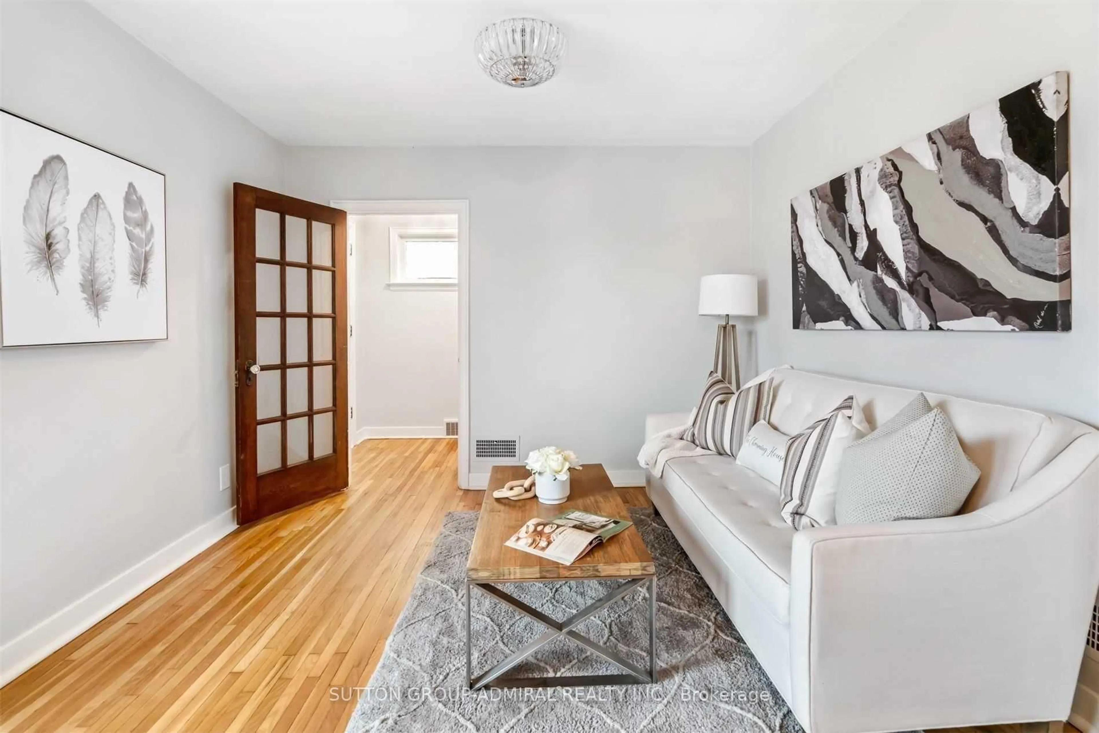 Living room with furniture, wood/laminate floor for 3813 St Peter Ave, Niagara Falls Ontario L2J 2N7