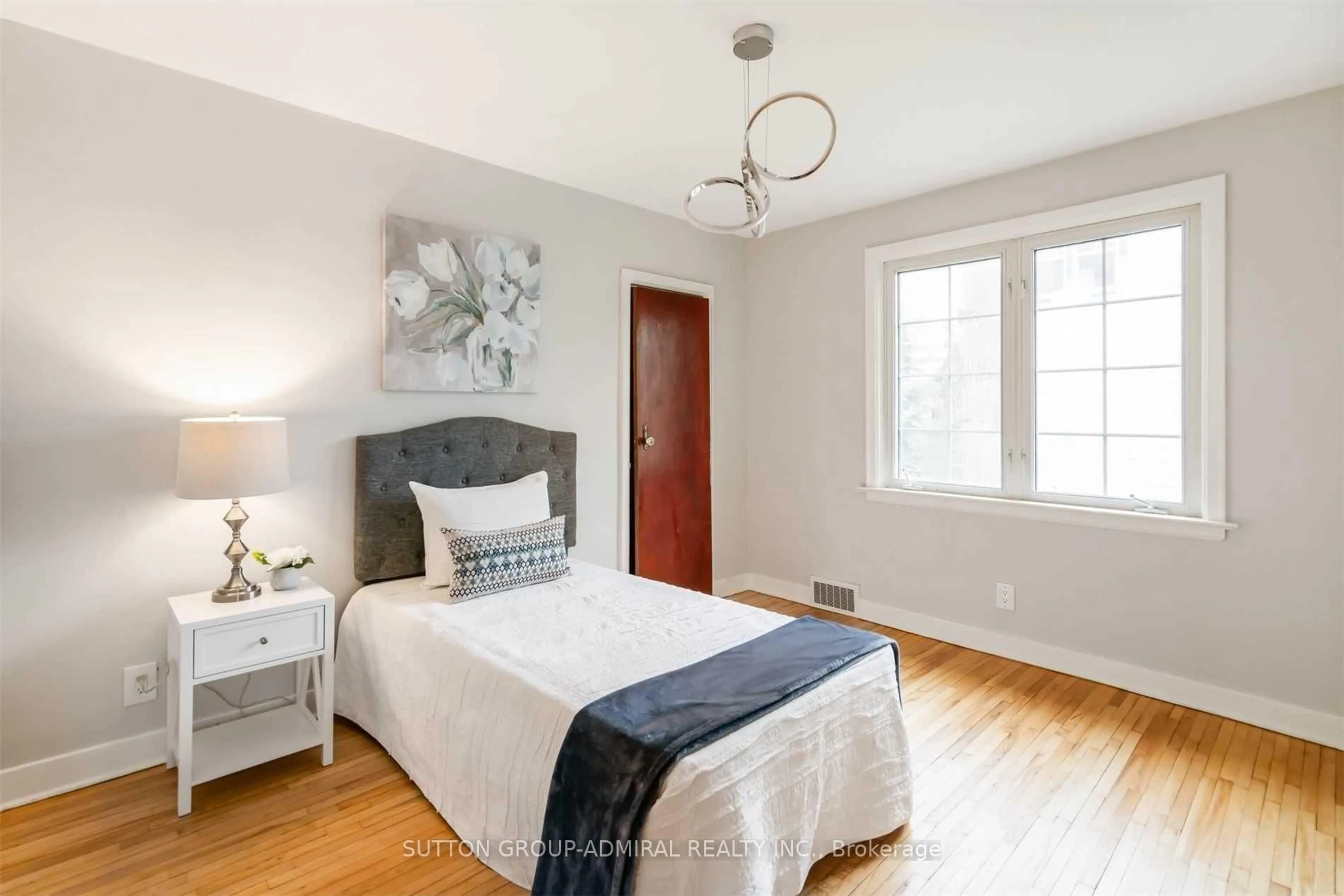 Bedroom with bed, wood/laminate floor for 3813 St Peter Ave, Niagara Falls Ontario L2J 2N7