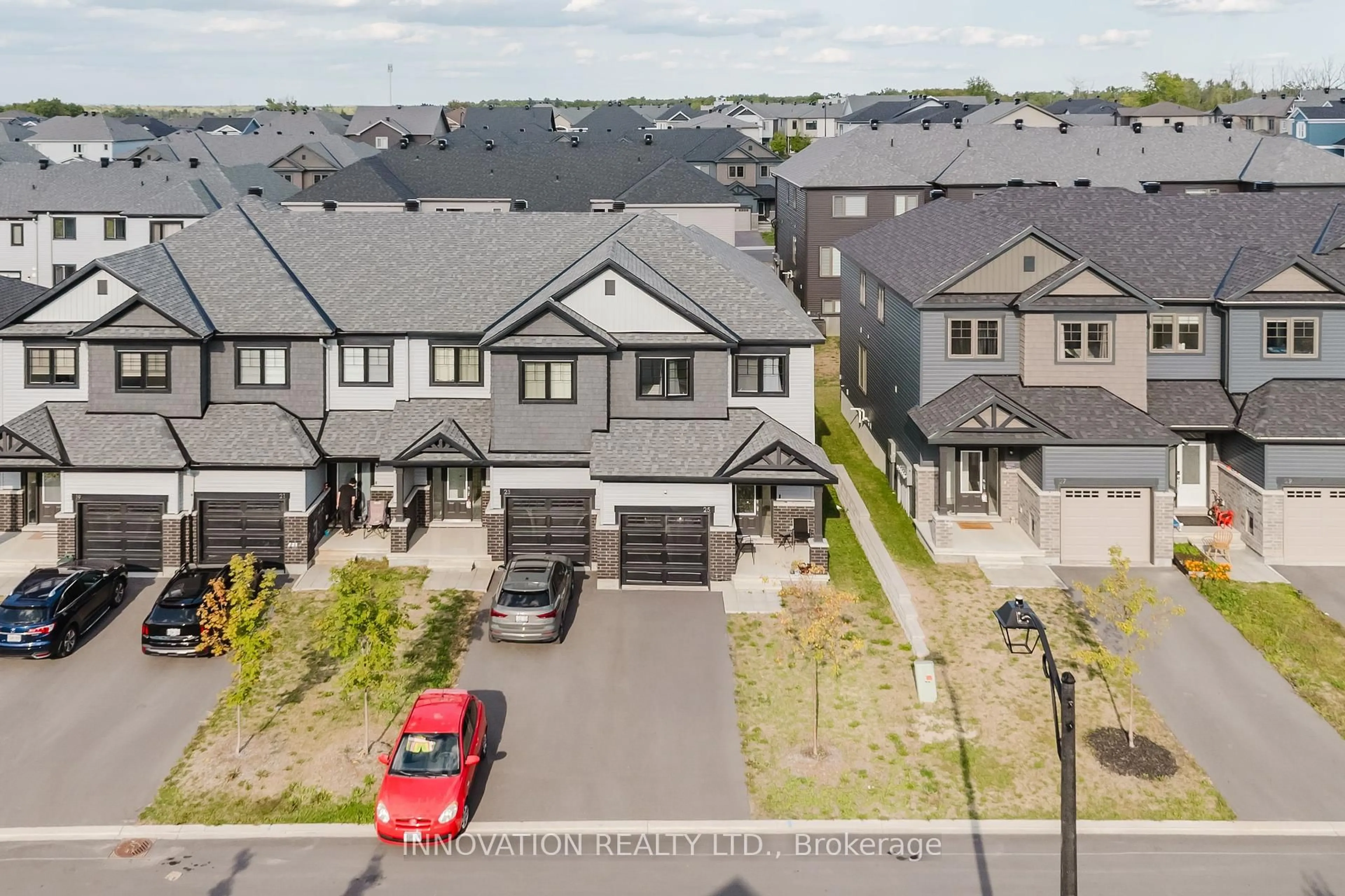 A pic from outside/outdoor area/front of a property/back of a property/a pic from drone, street for 25 Atop Lane, Ottawa Ontario K1X 1G6