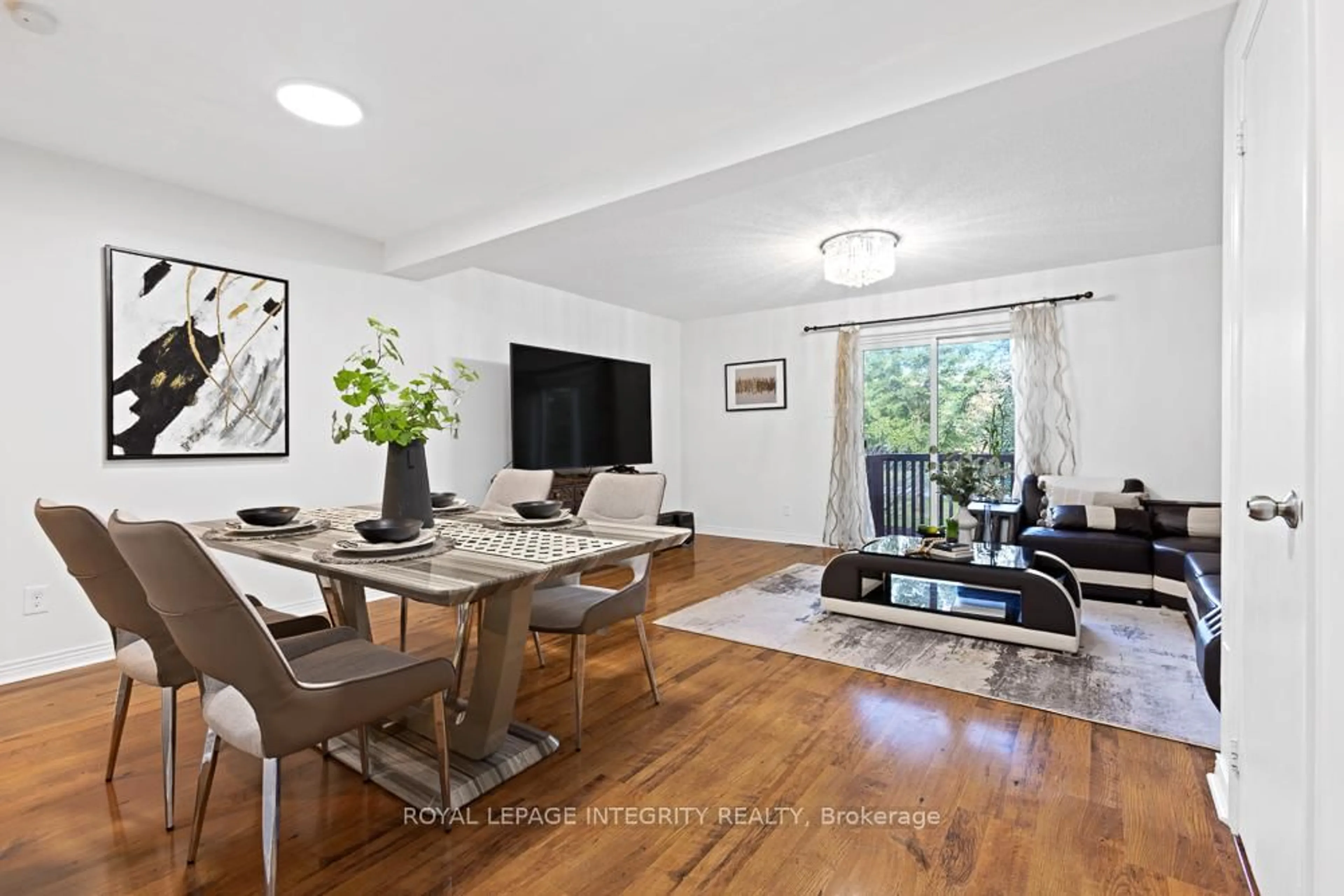 Living room with furniture, wood/laminate floor for 498 Sandhamn Private, Ottawa Ontario K1T 2Z6