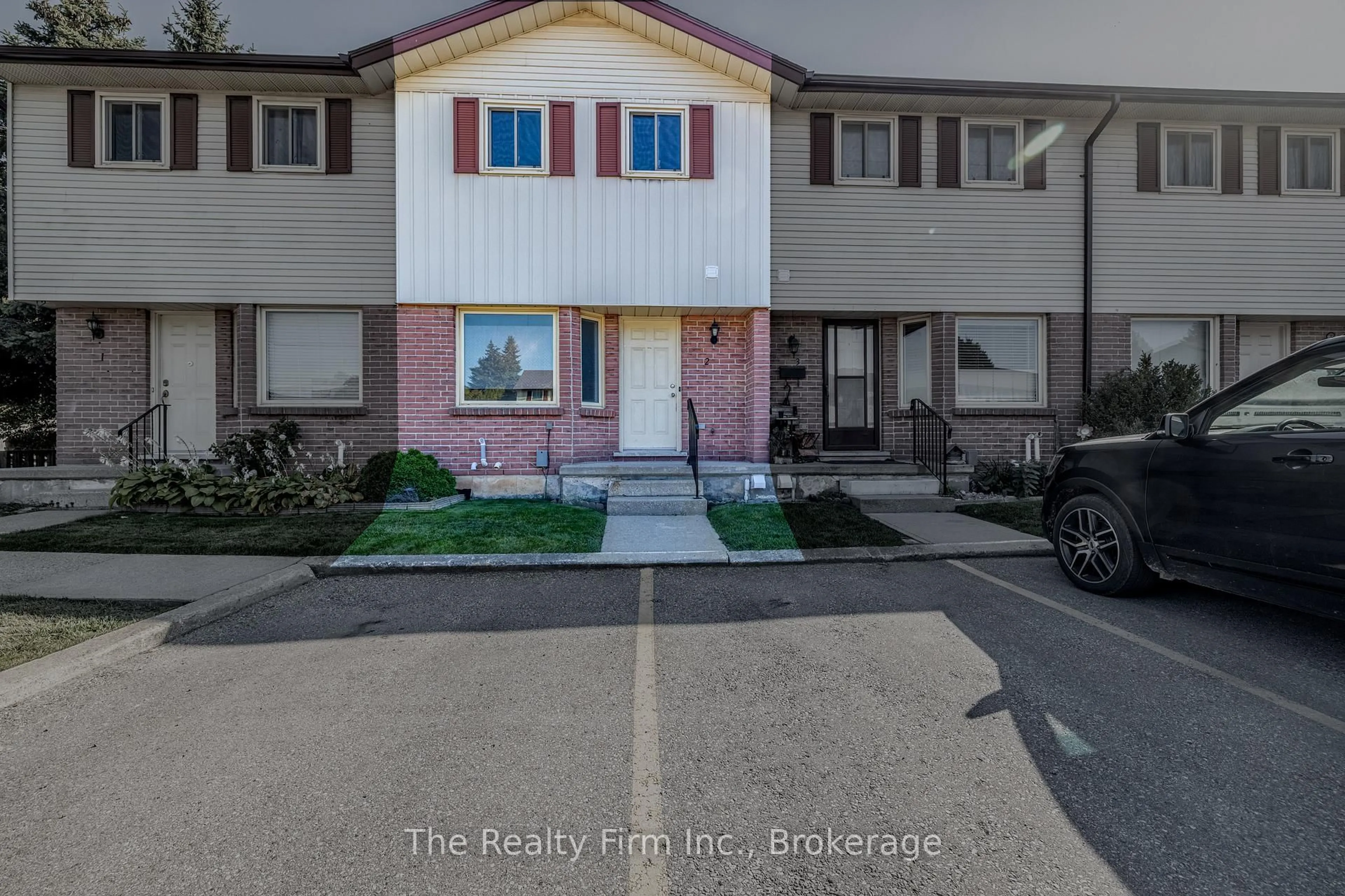 A pic from outside/outdoor area/front of a property/back of a property/a pic from drone, street for 1135 Nellis St #2, Woodstock Ontario N4T 1P7