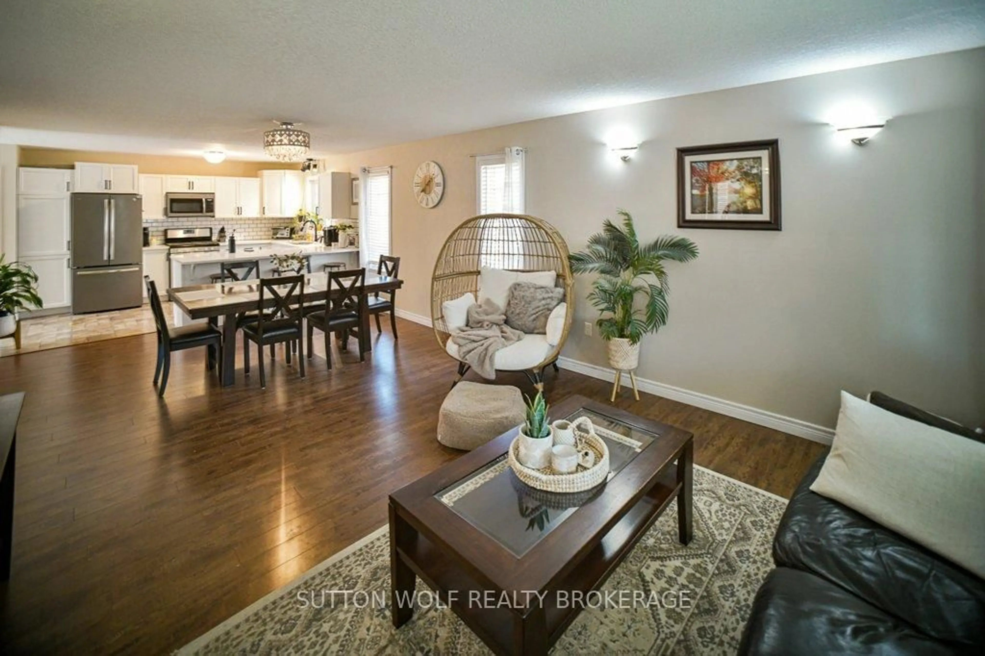 Living room with furniture, wood/laminate floor for 22 Pittao Pl, Strathroy-Caradoc Ontario N7G 4E7