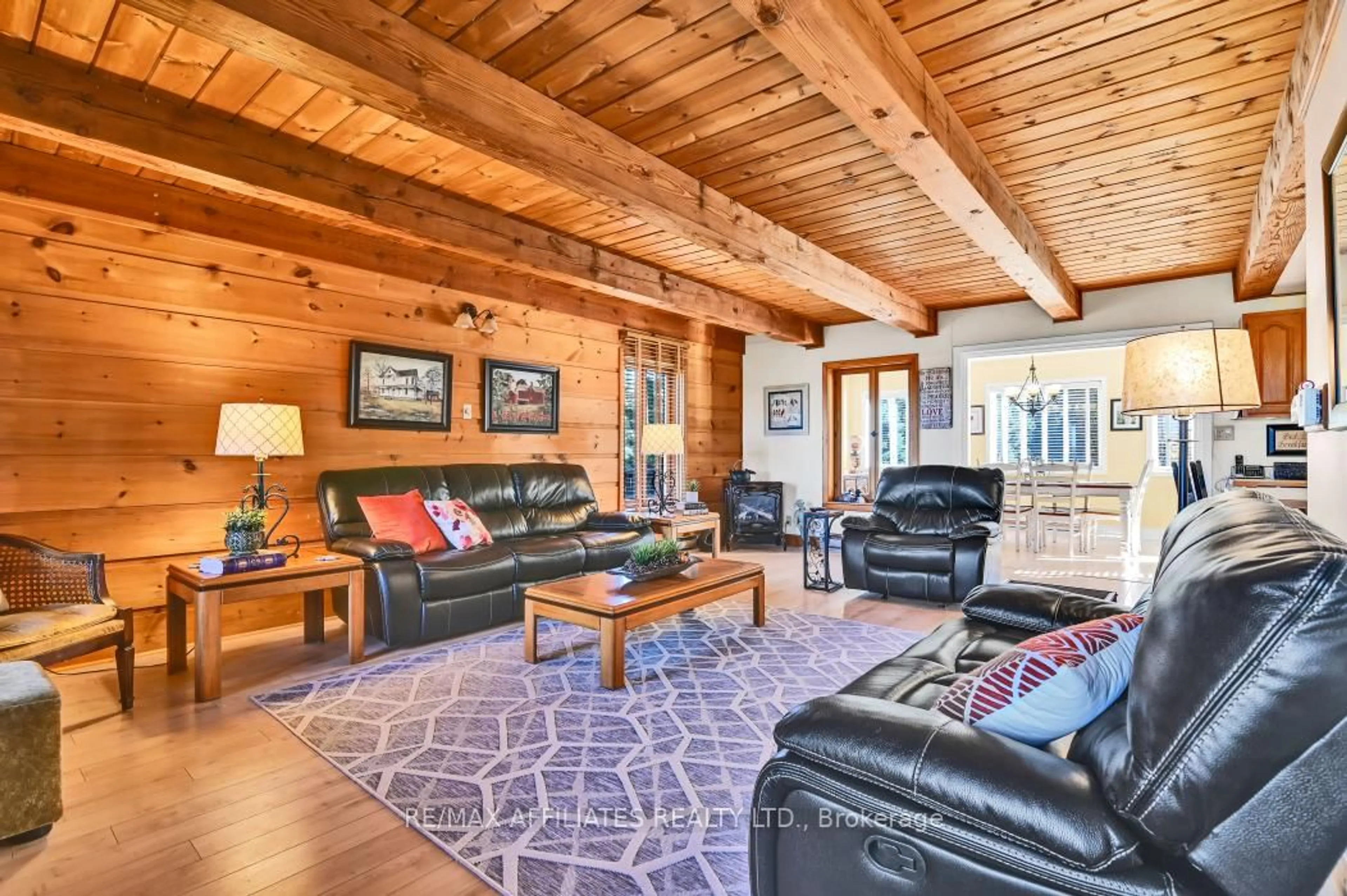 Living room with furniture, wood/laminate floor for 81 Trotters Lane, Rideau Lakes Ontario K0G 1X0