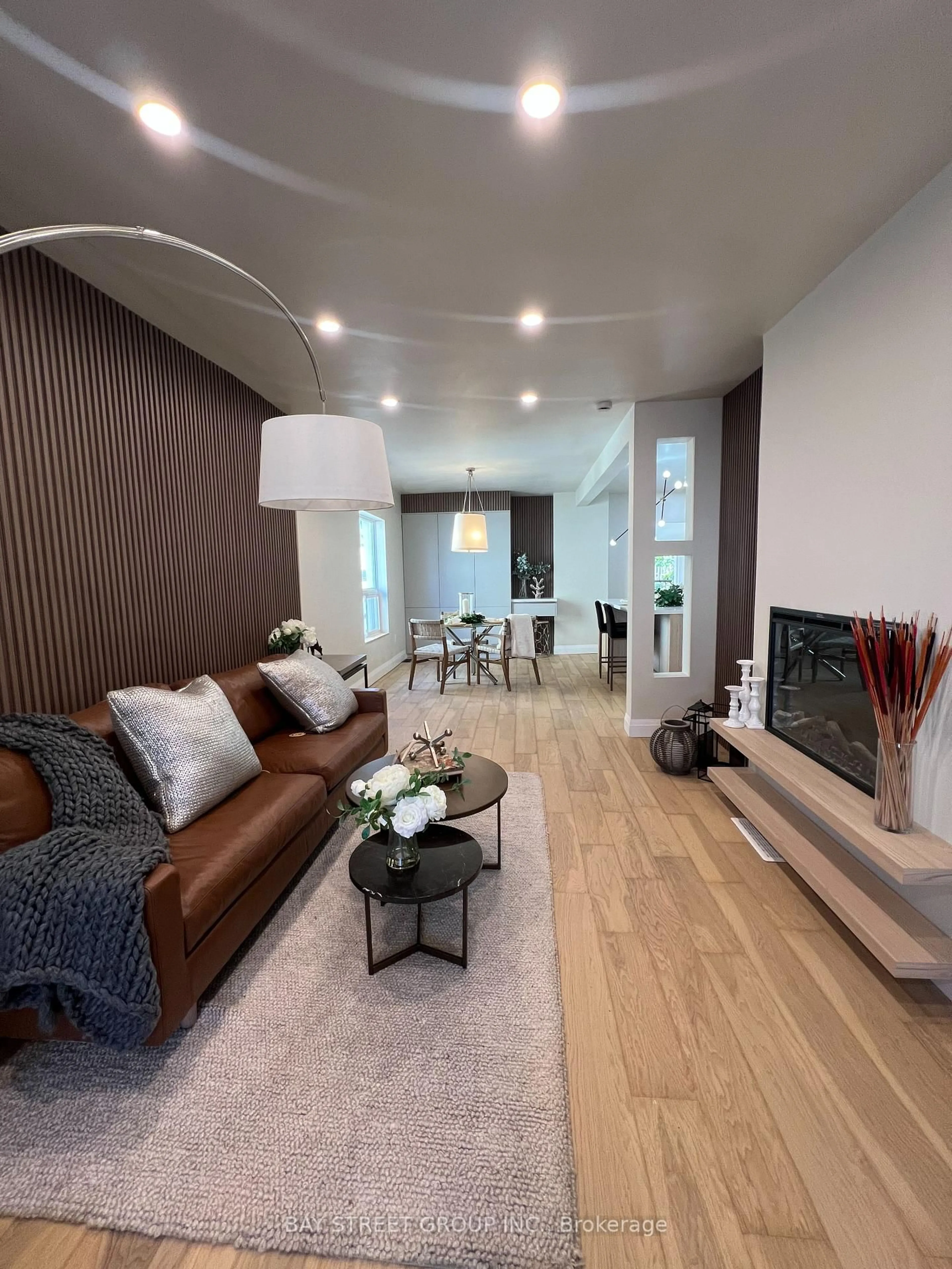 Living room with furniture, wood/laminate floor for 396 Emerald St, Hamilton Ontario L8L 5L9