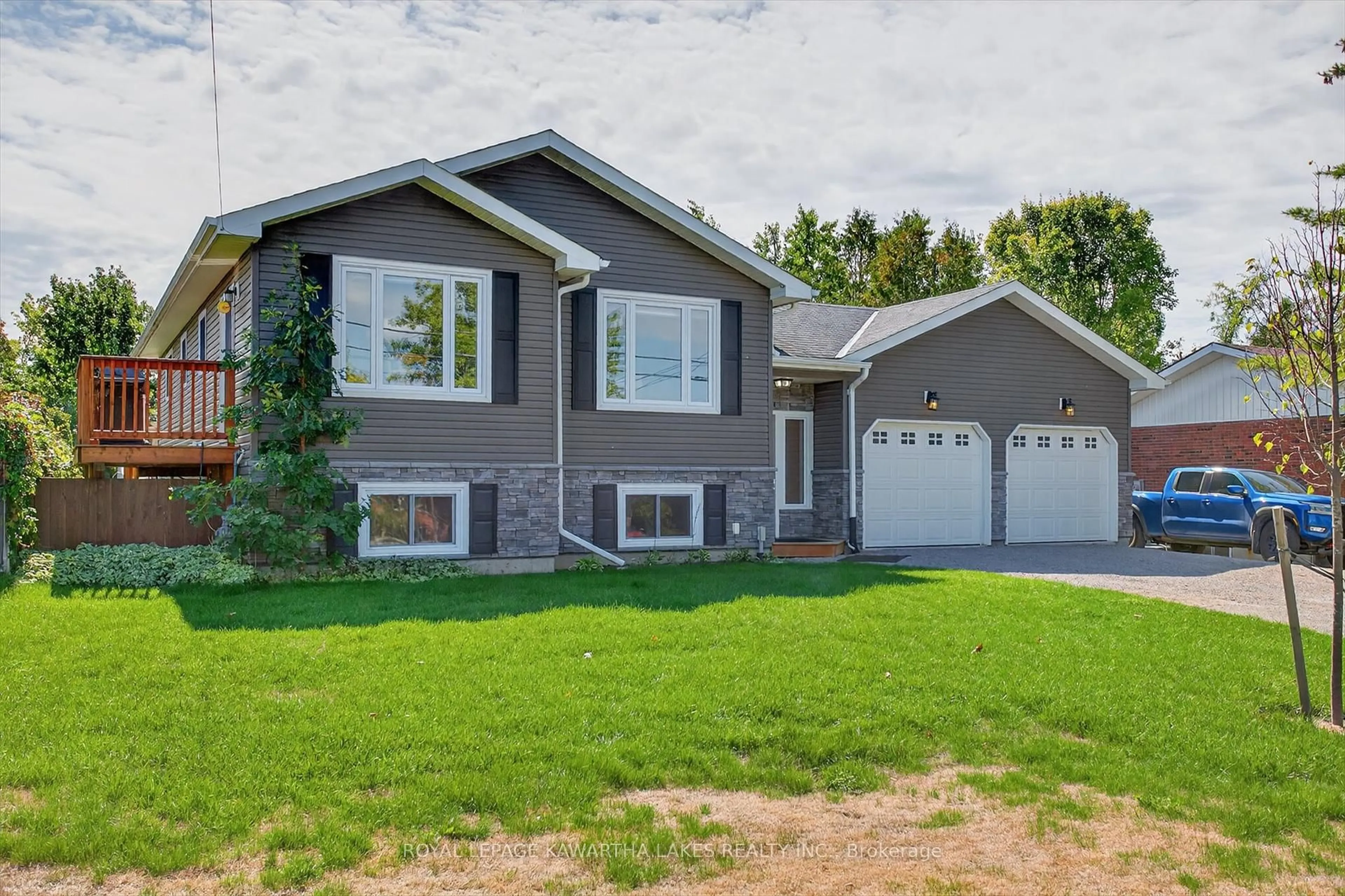 Home with vinyl exterior material, street for 21 Hillside Dr, Kawartha Lakes Ontario K9V 1A3