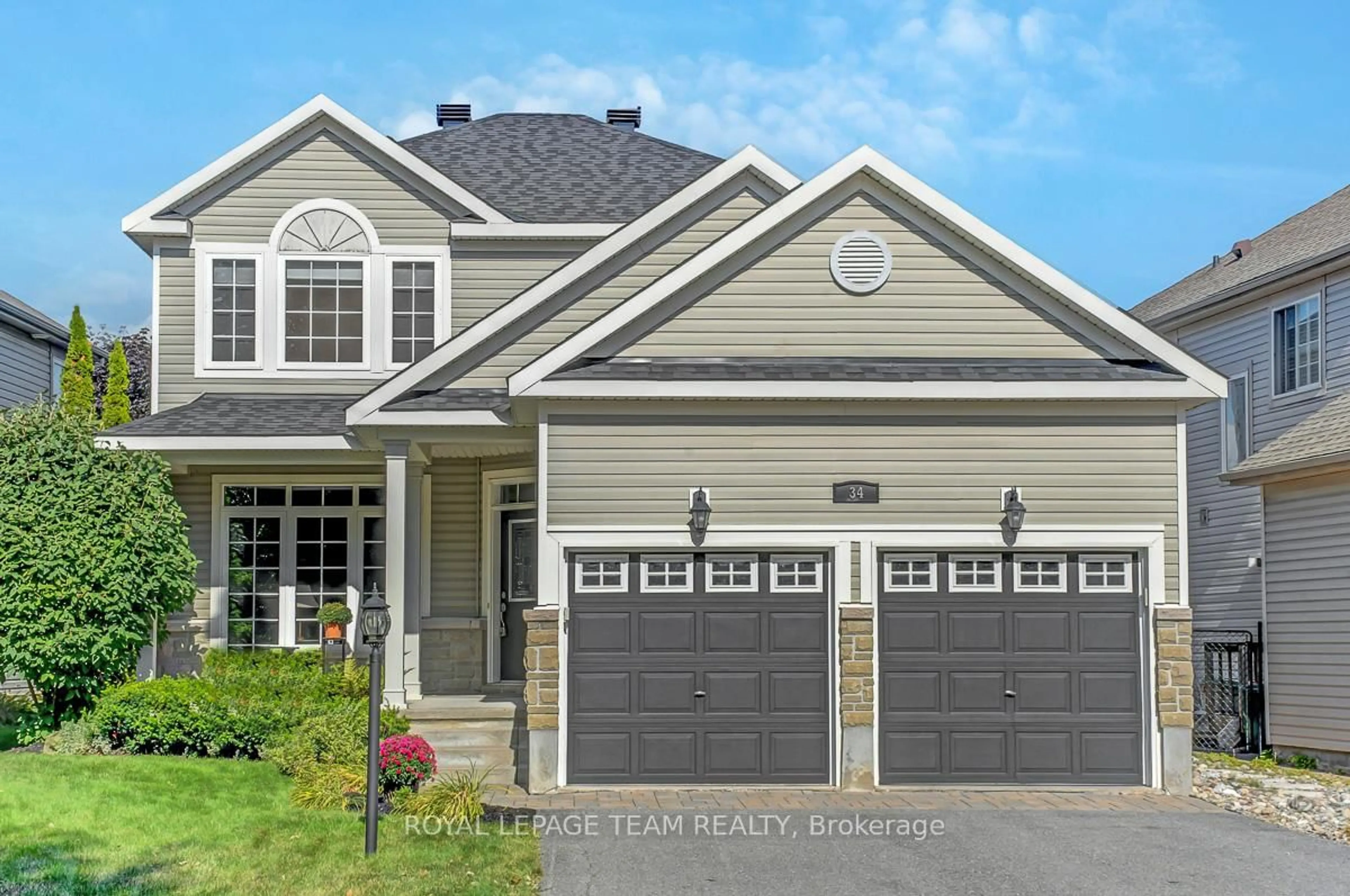 Home with vinyl exterior material, street for 34 Calderwood Way, Ottawa Ontario K2J 5L9