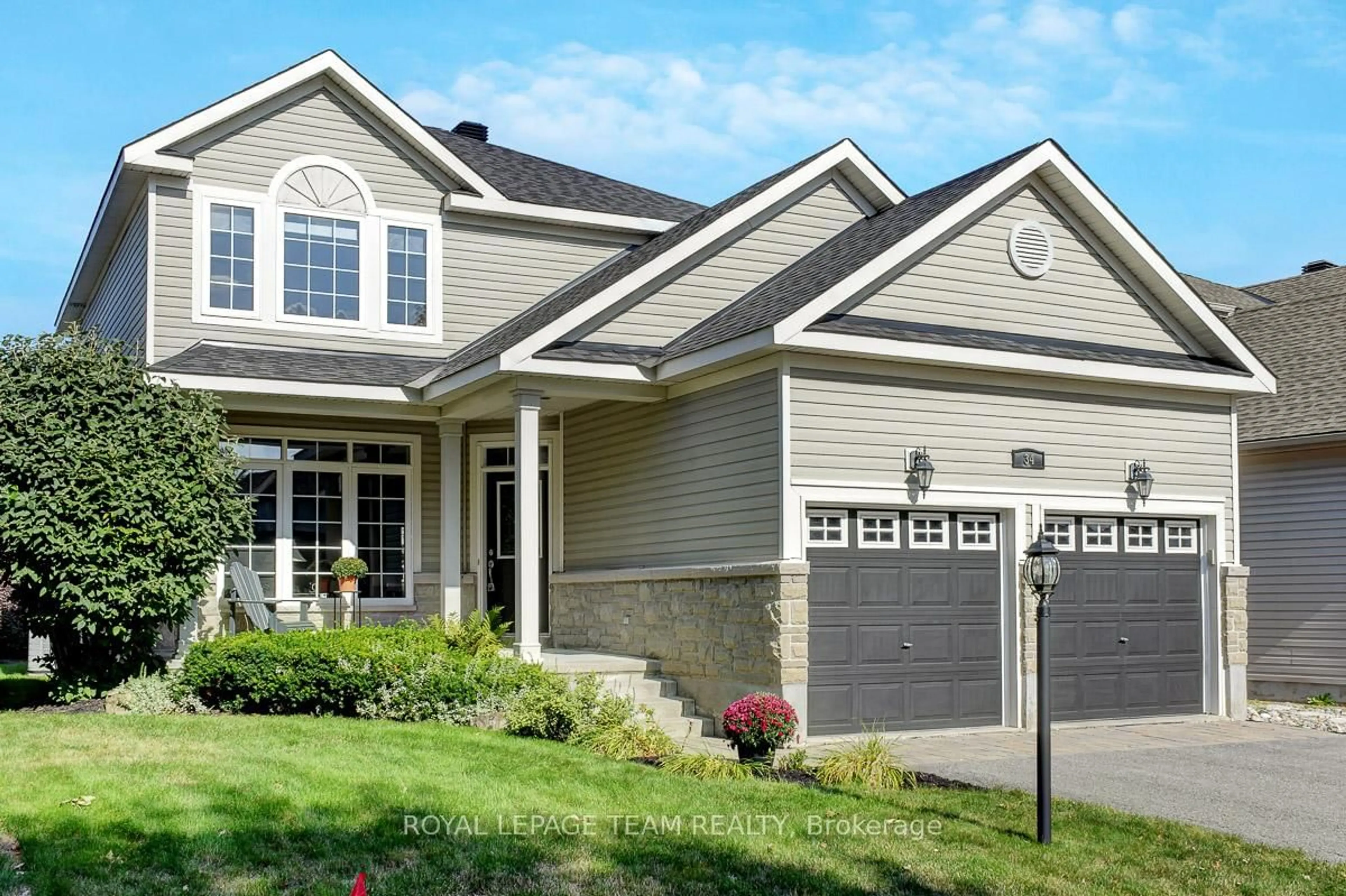 Home with vinyl exterior material, street for 34 Calderwood Way, Ottawa Ontario K2J 5L9