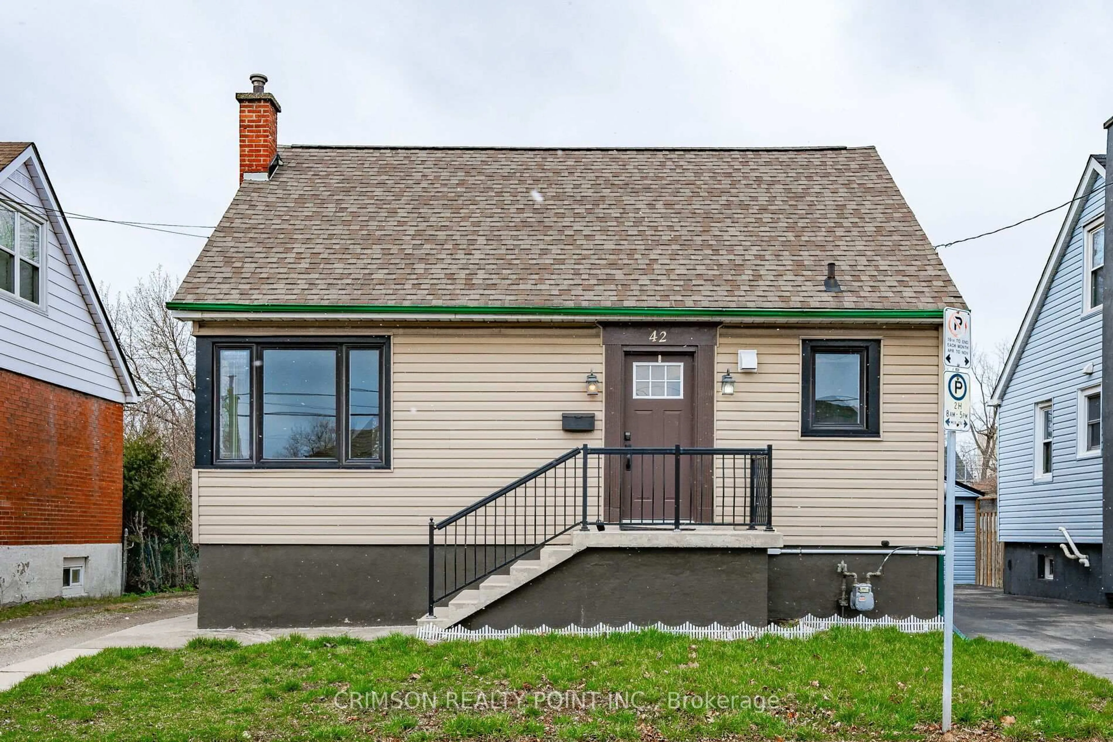 Home with vinyl exterior material, street for 42 East 11th St, Hamilton Ontario L9A 3T2
