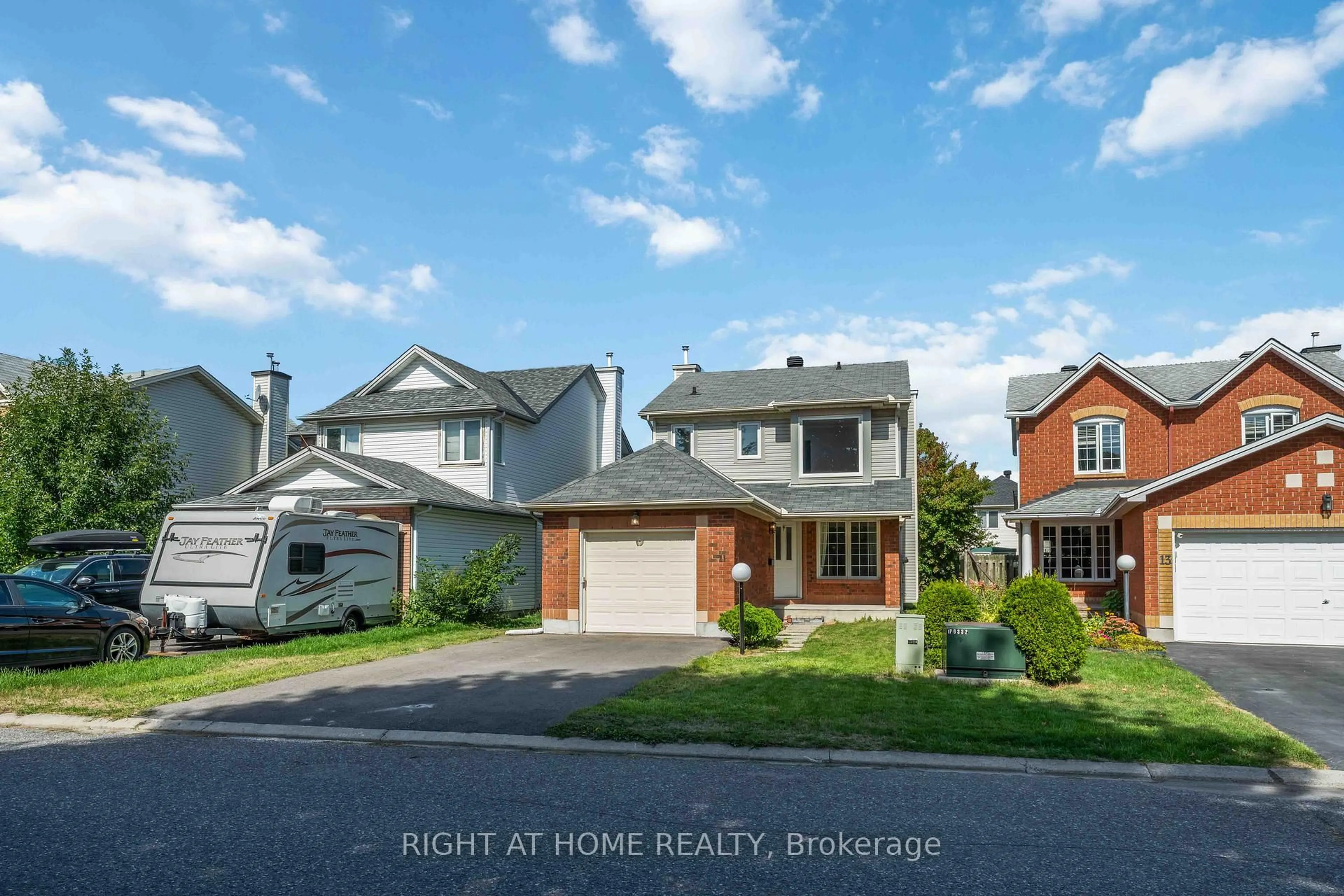 A pic from outside/outdoor area/front of a property/back of a property/a pic from drone, street for 11 Wiltshire Circ, Ottawa Ontario K2J 4K9