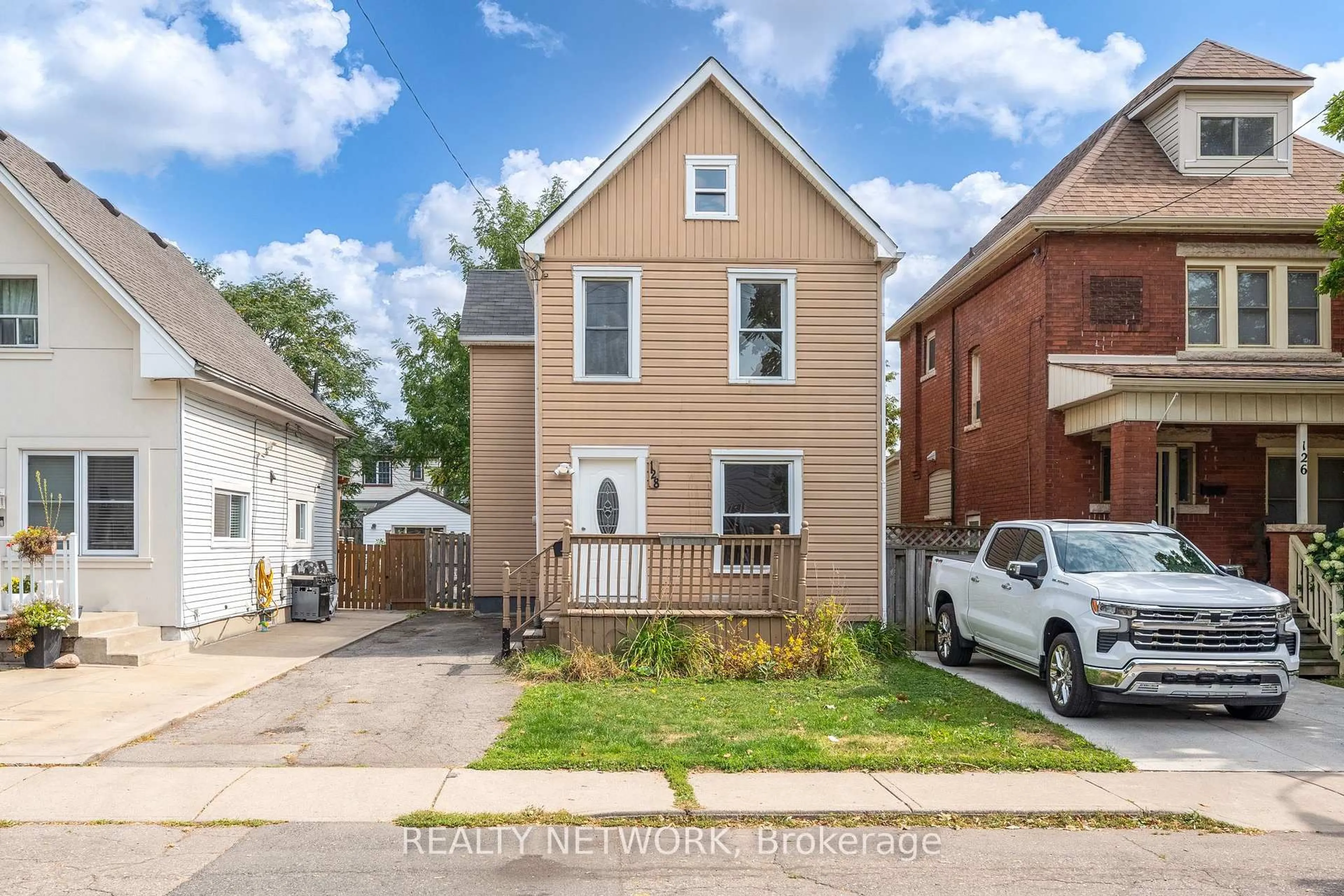Home with brick exterior material, street for 128 Kensington Ave, Hamilton Ontario L8L 7N5