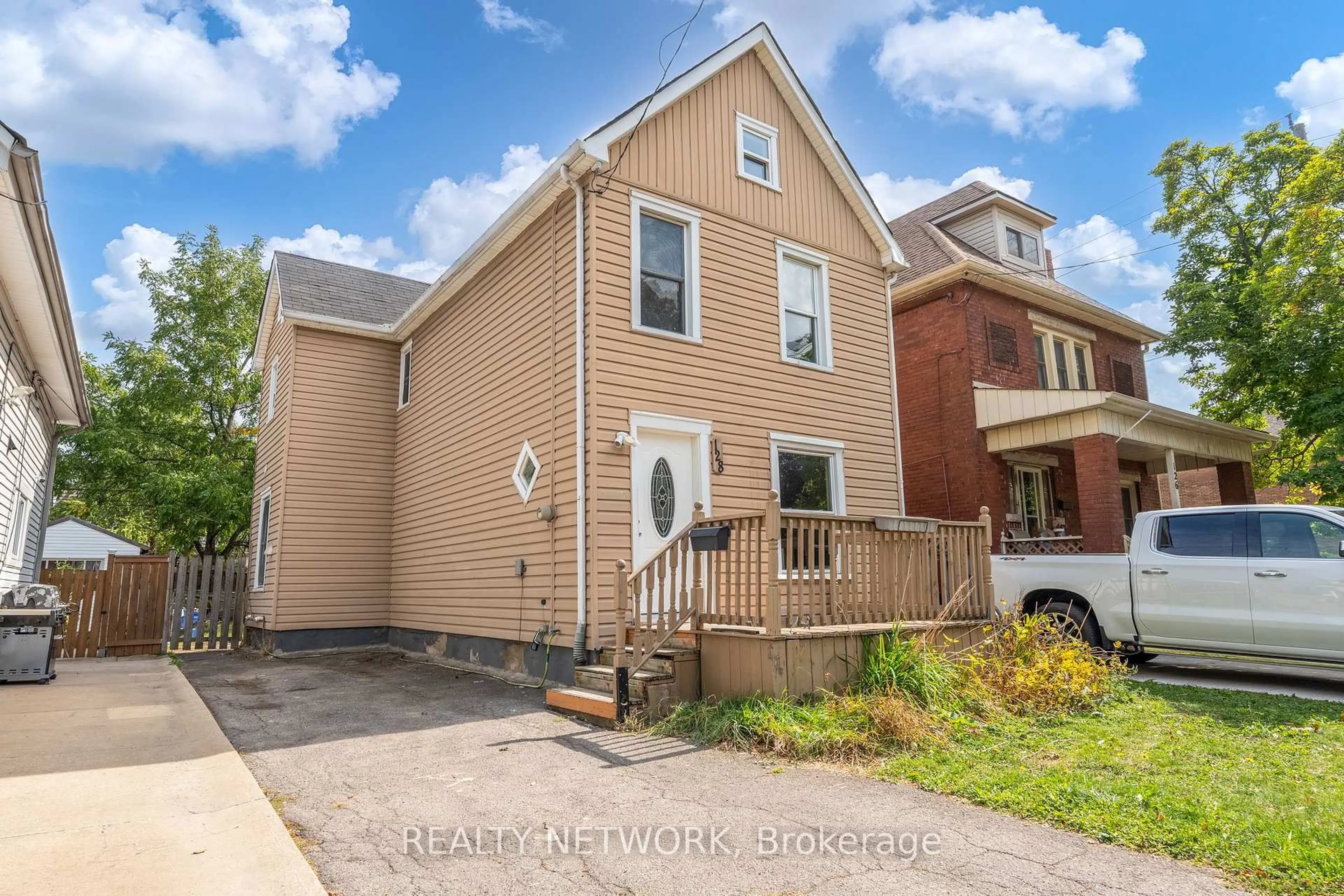 Home with brick exterior material, street for 128 Kensington Ave, Hamilton Ontario L8L 7N5