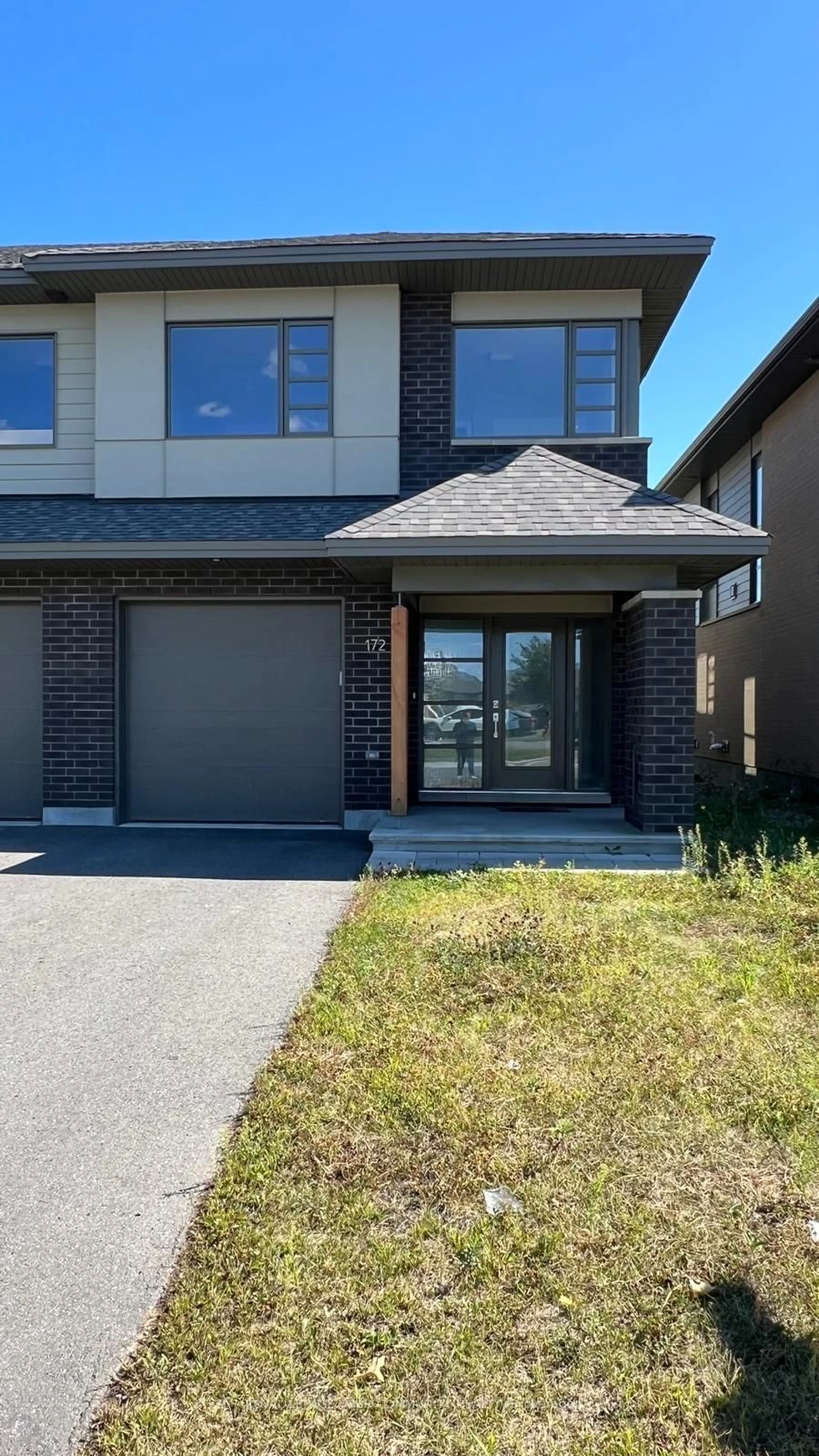 Home with brick exterior material, street for 172 Shuttleworth Dr, Ottawa Ontario K1T 0S8