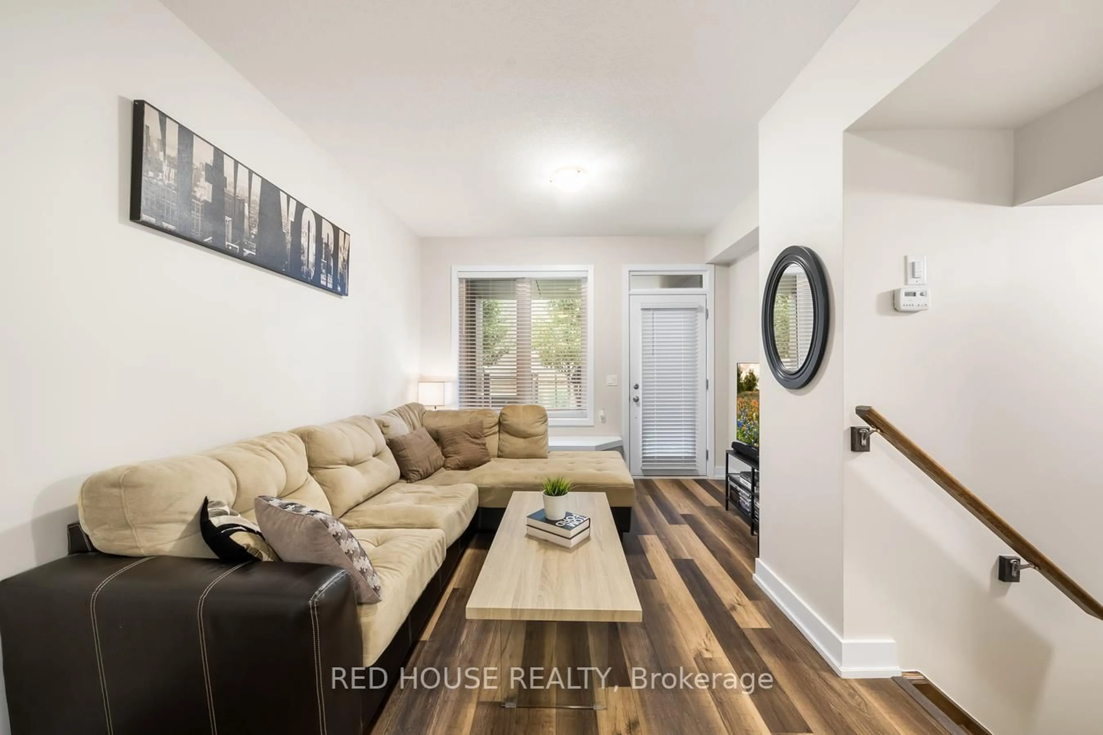 Living room with furniture, wood/laminate floor for 261 Skinner Rd #21, Hamilton Ontario L0R 2H1