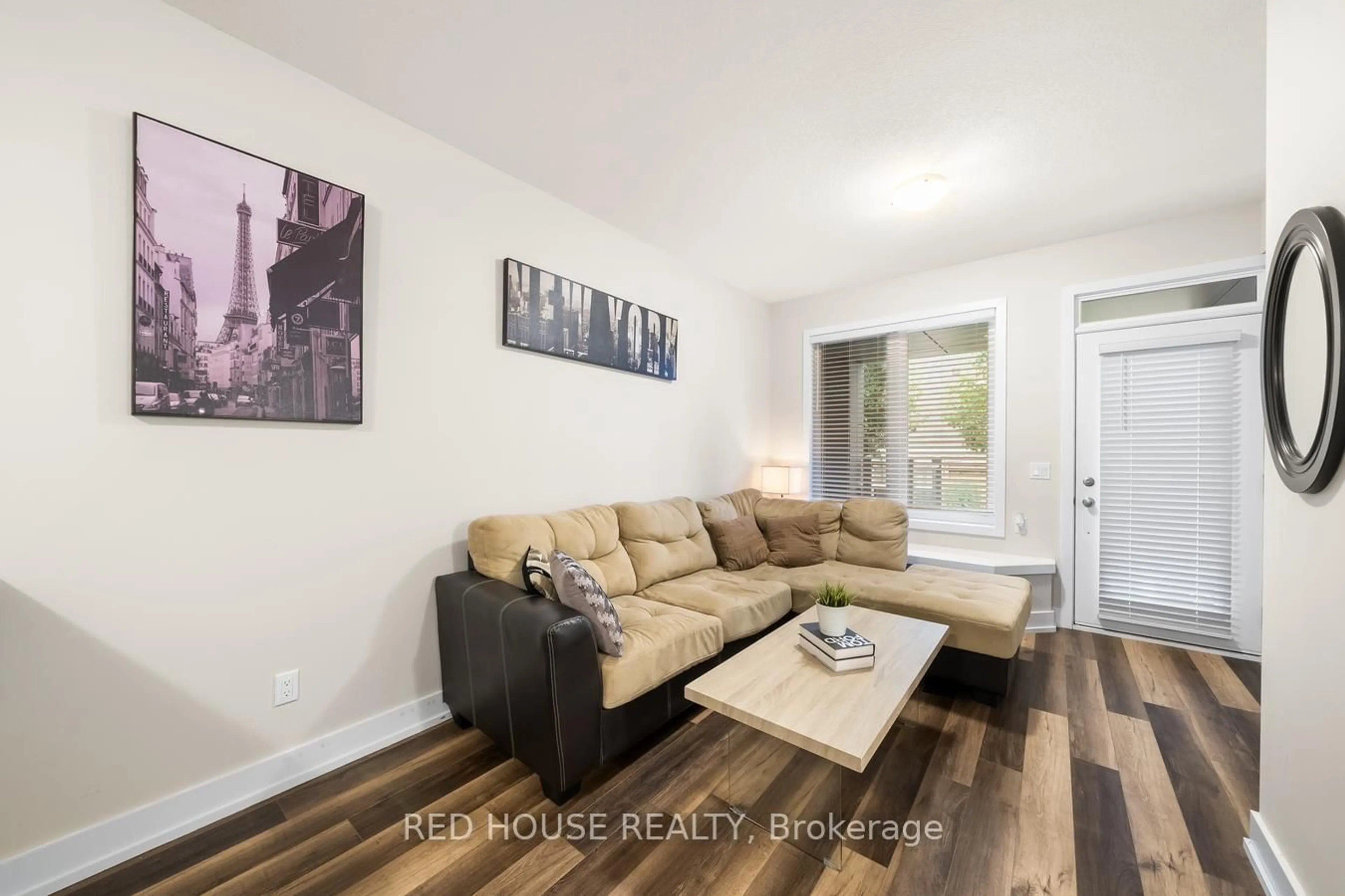 Living room with furniture, wood/laminate floor for 261 Skinner Rd #21, Hamilton Ontario L0R 2H1