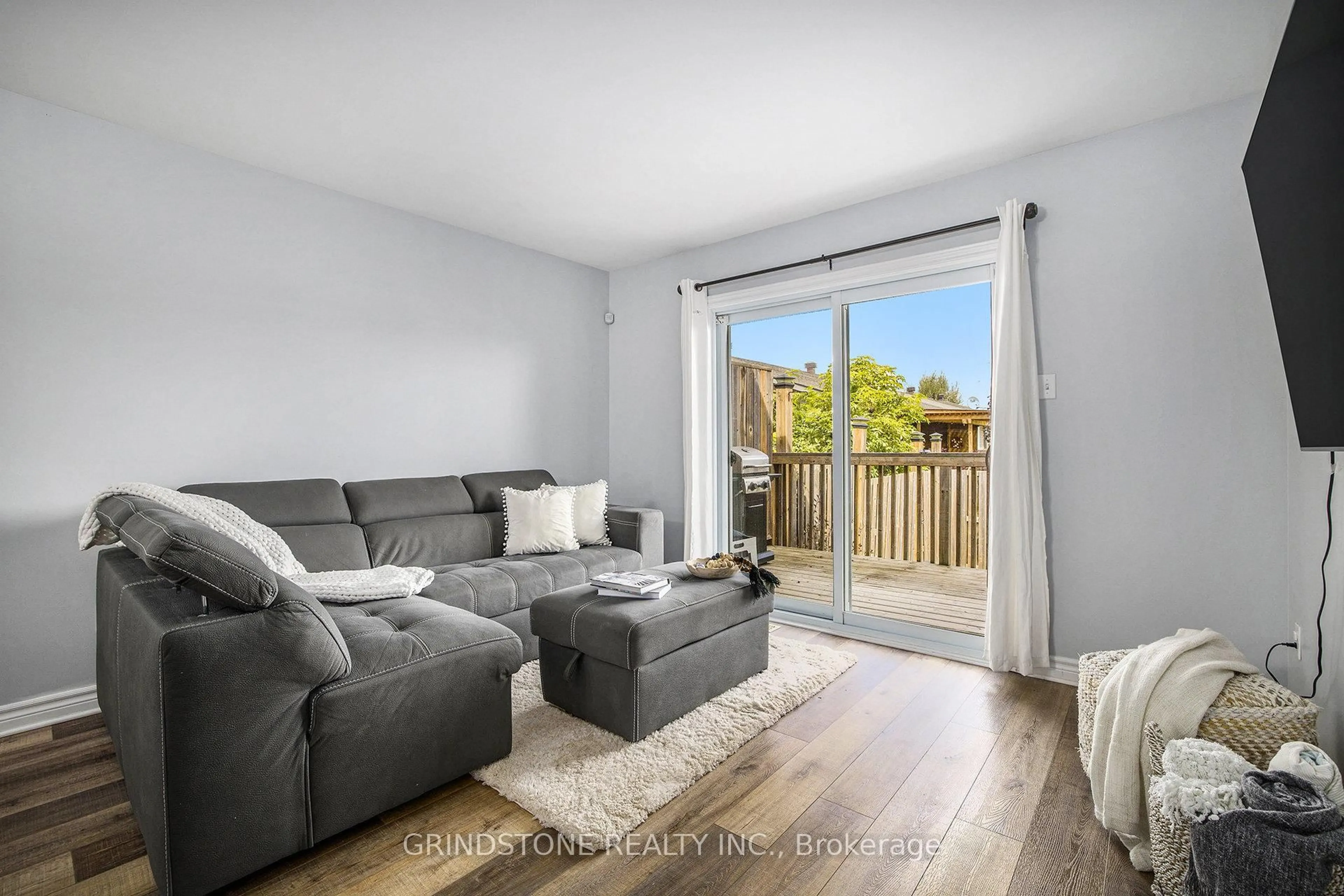 Living room with furniture, wood/laminate floor for 213 Foxden St, Renfrew Ontario K7V 0A1
