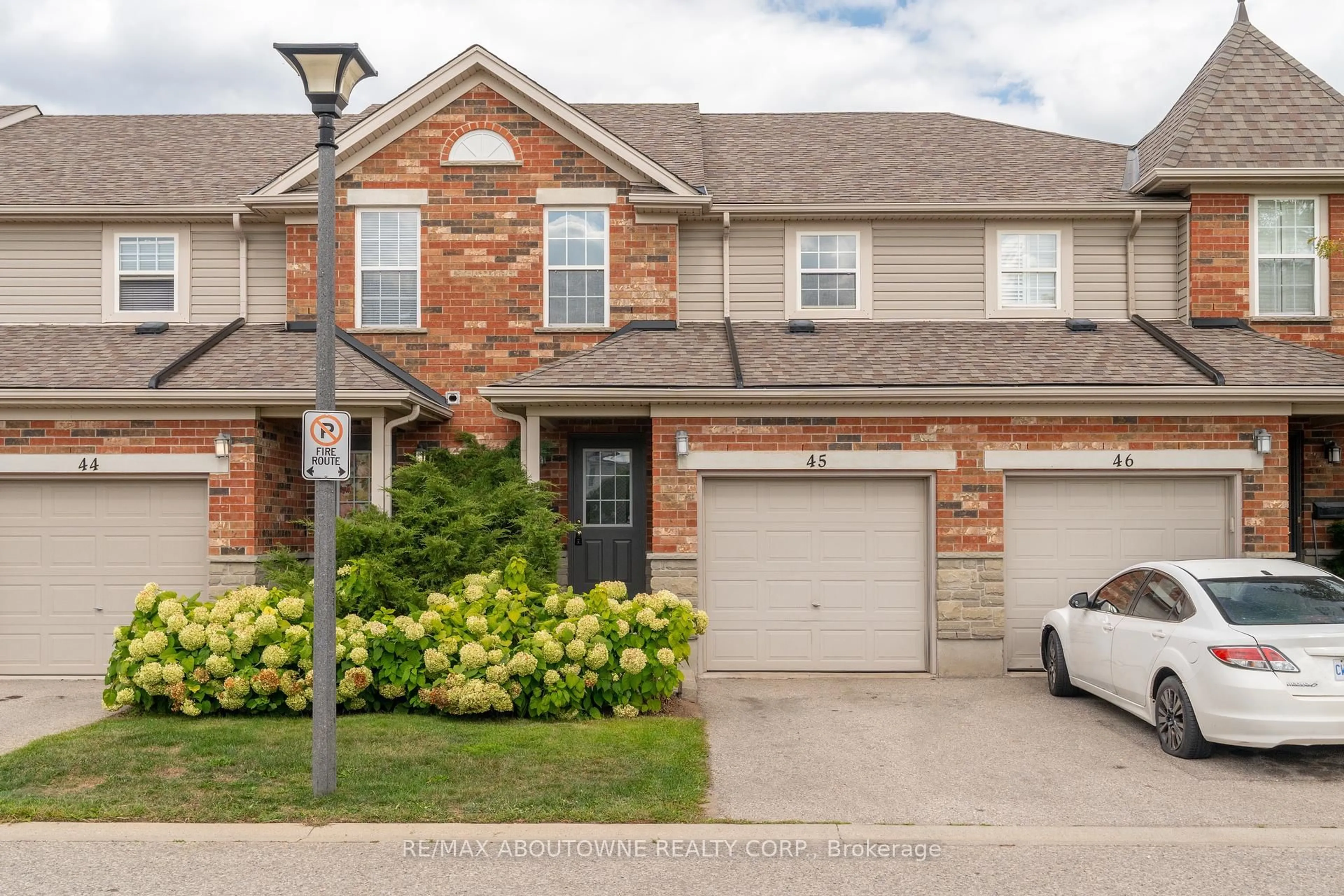 Home with brick exterior material, street for 124 Gosling Gdns #45, Guelph Ontario N1G 5K6