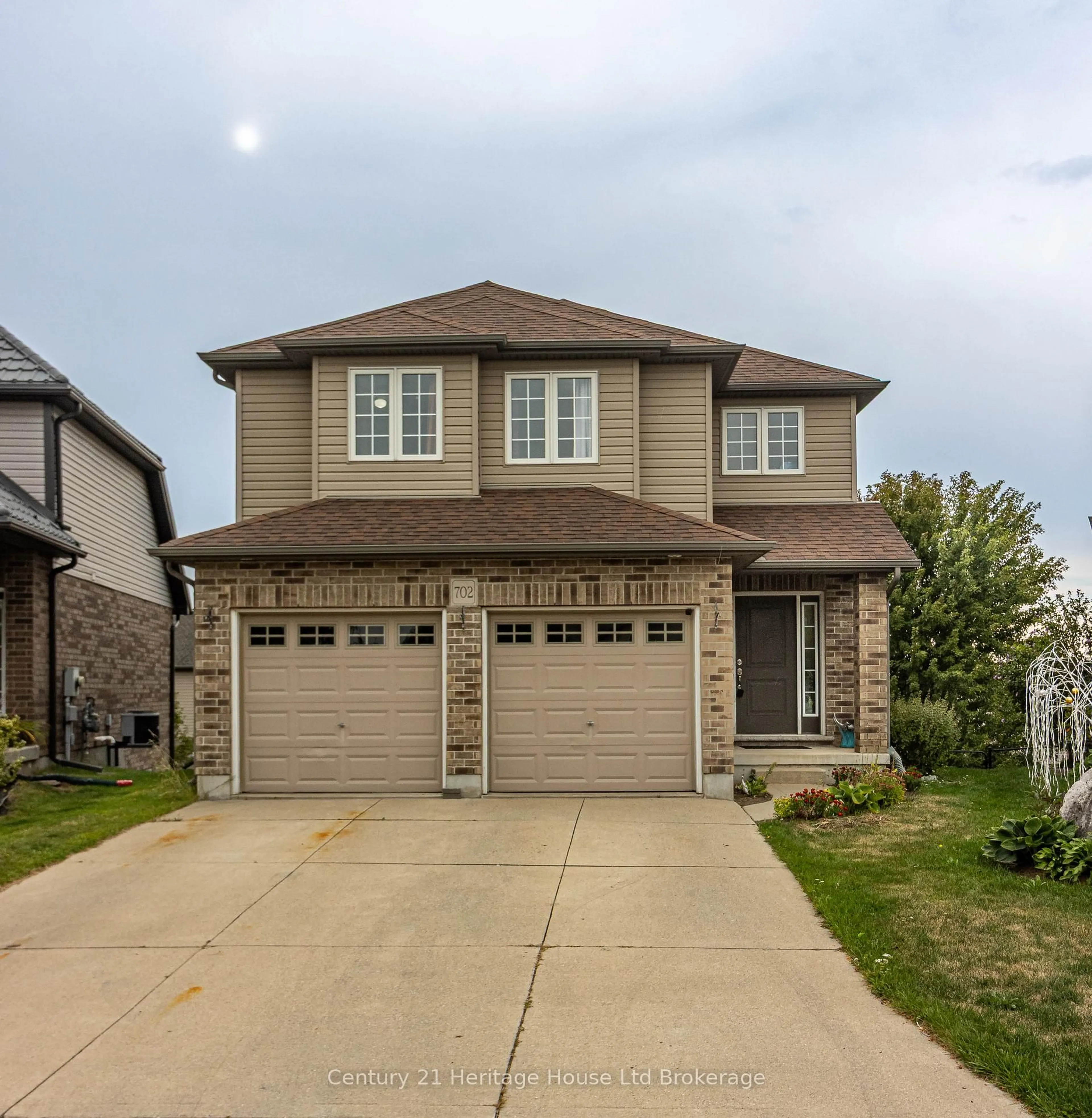 Home with brick exterior material, street for 702 Frontenac Cres, Woodstock Ontario N4V 0B1