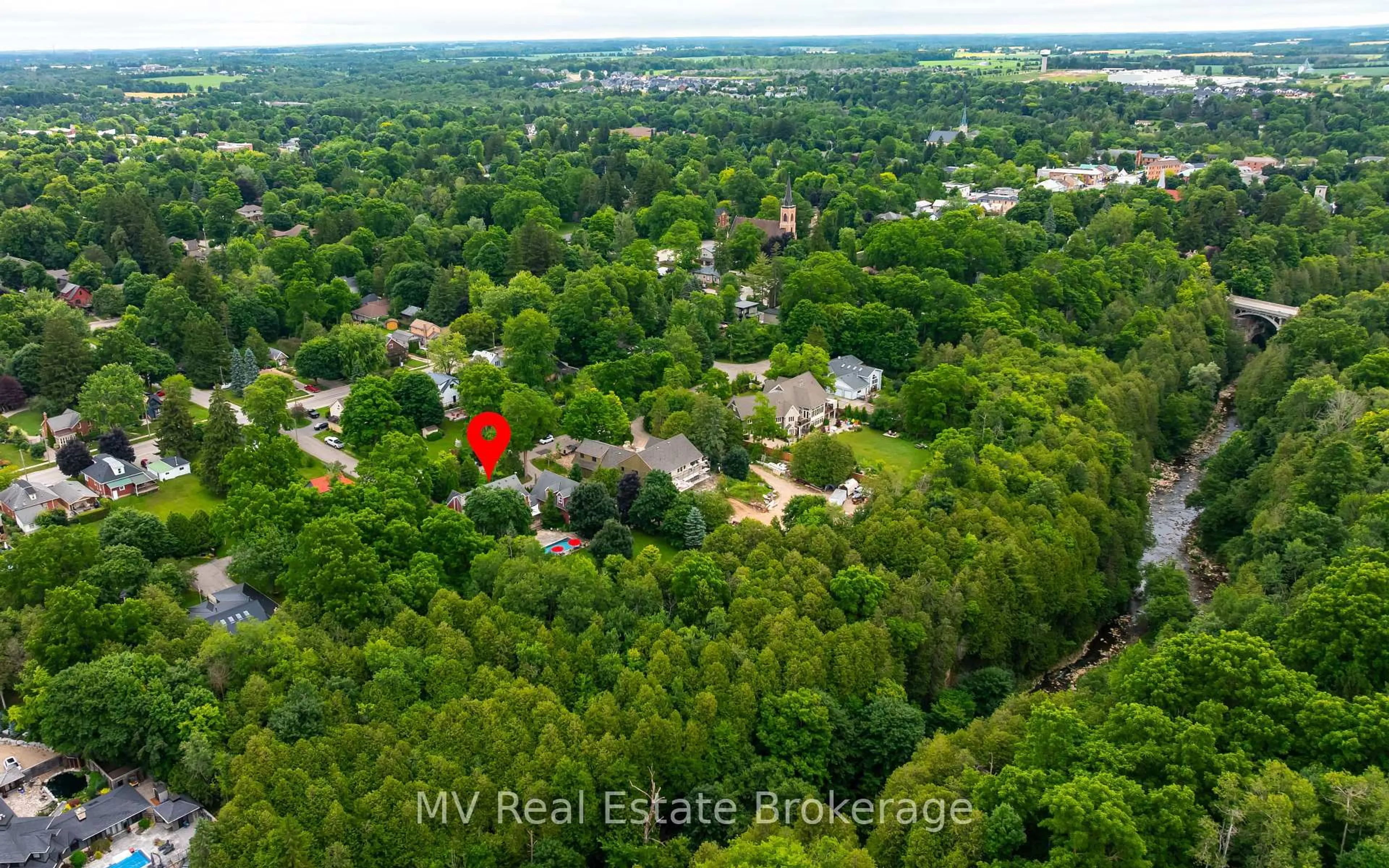 A pic from outside/outdoor area/front of a property/back of a property/a pic from drone, forest/trees view for 322 North St, Centre Wellington Ontario N0B 1S0