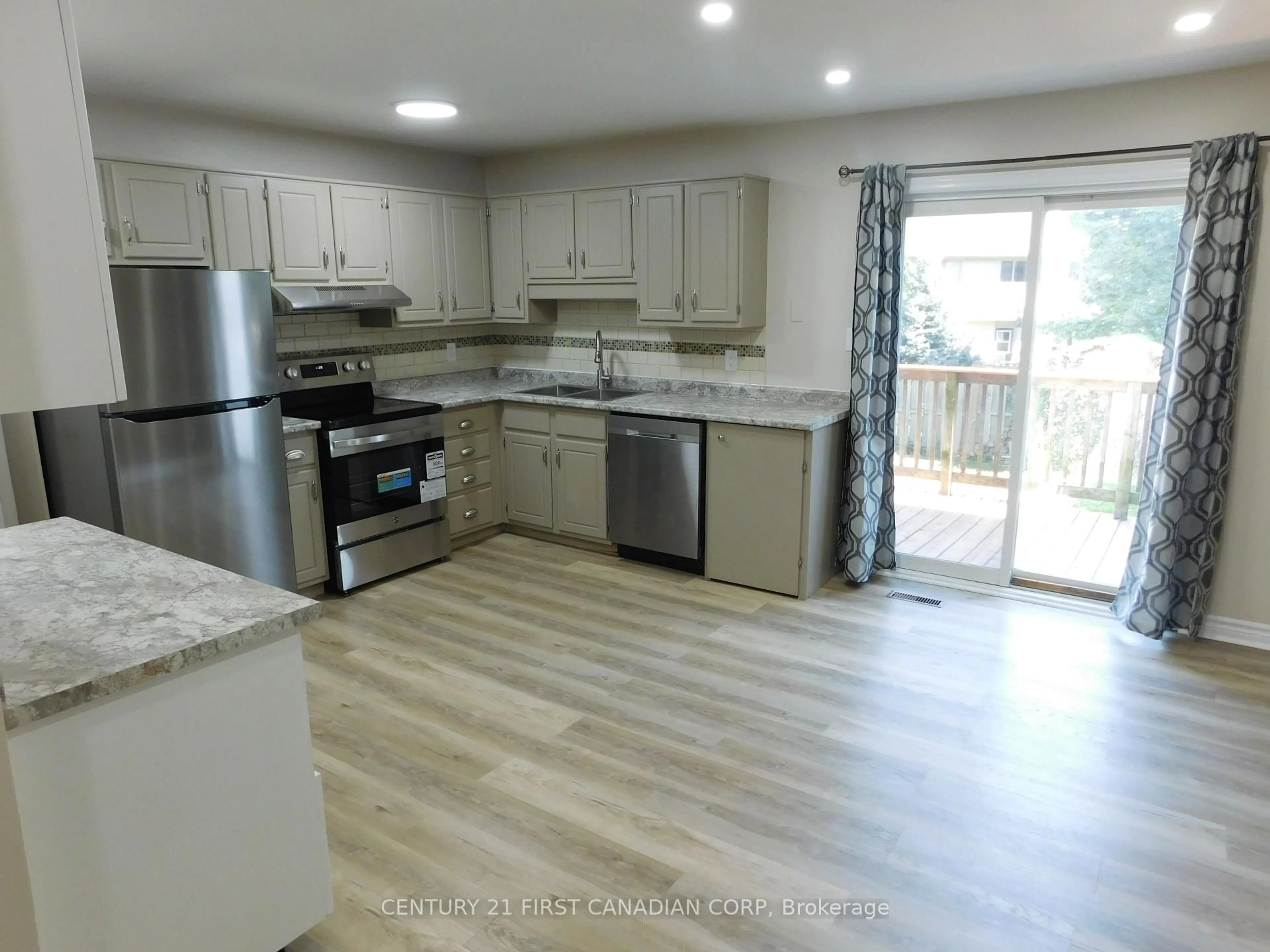 Open concept kitchen, wood/laminate floor for 1160 Limberlost Rd, London North Ontario N6G 3A5