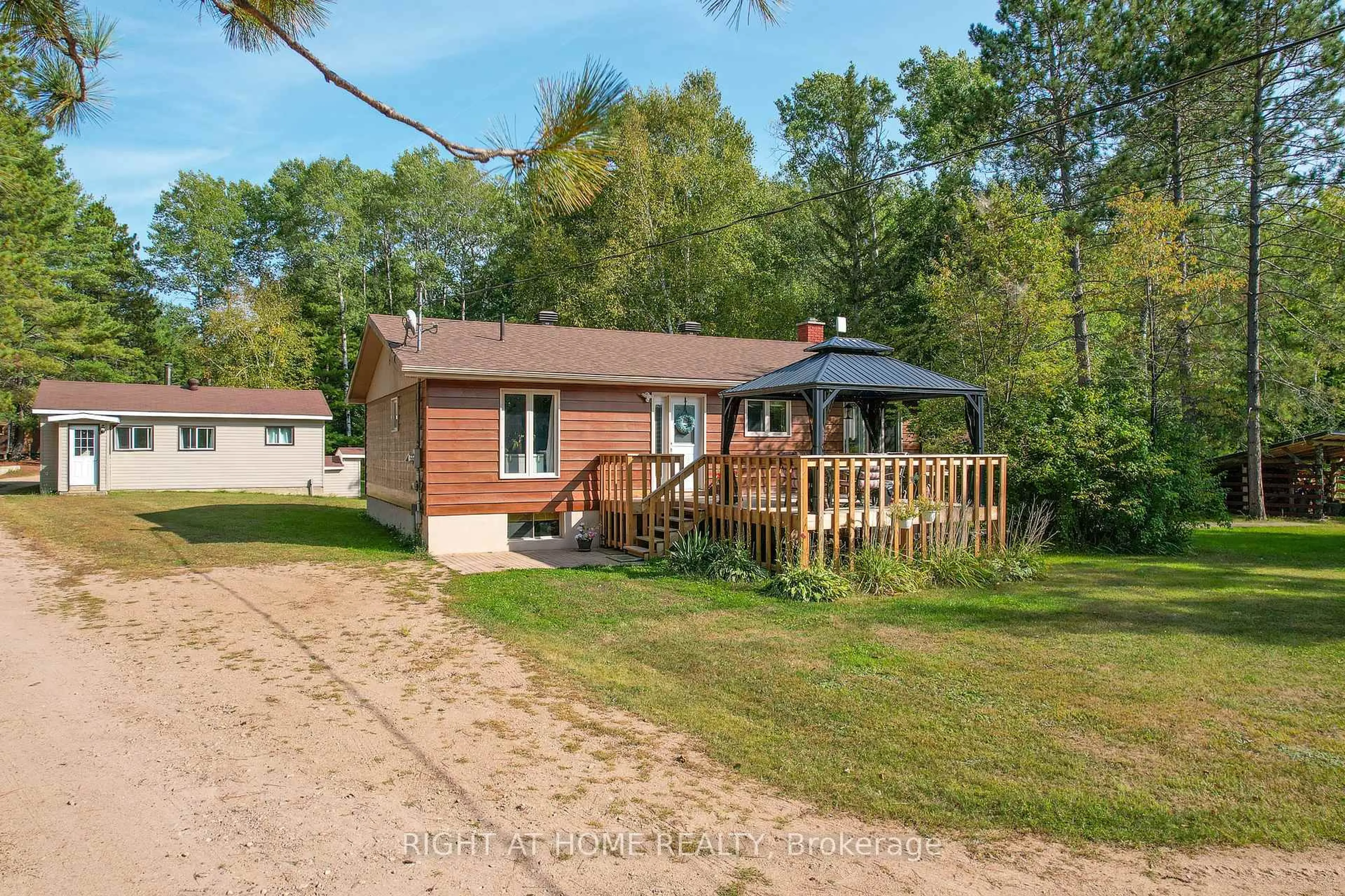 A pic from outside/outdoor area/front of a property/back of a property/a pic from drone, unknown for 618 HWY 630, Calvin Ontario P0H 1V0