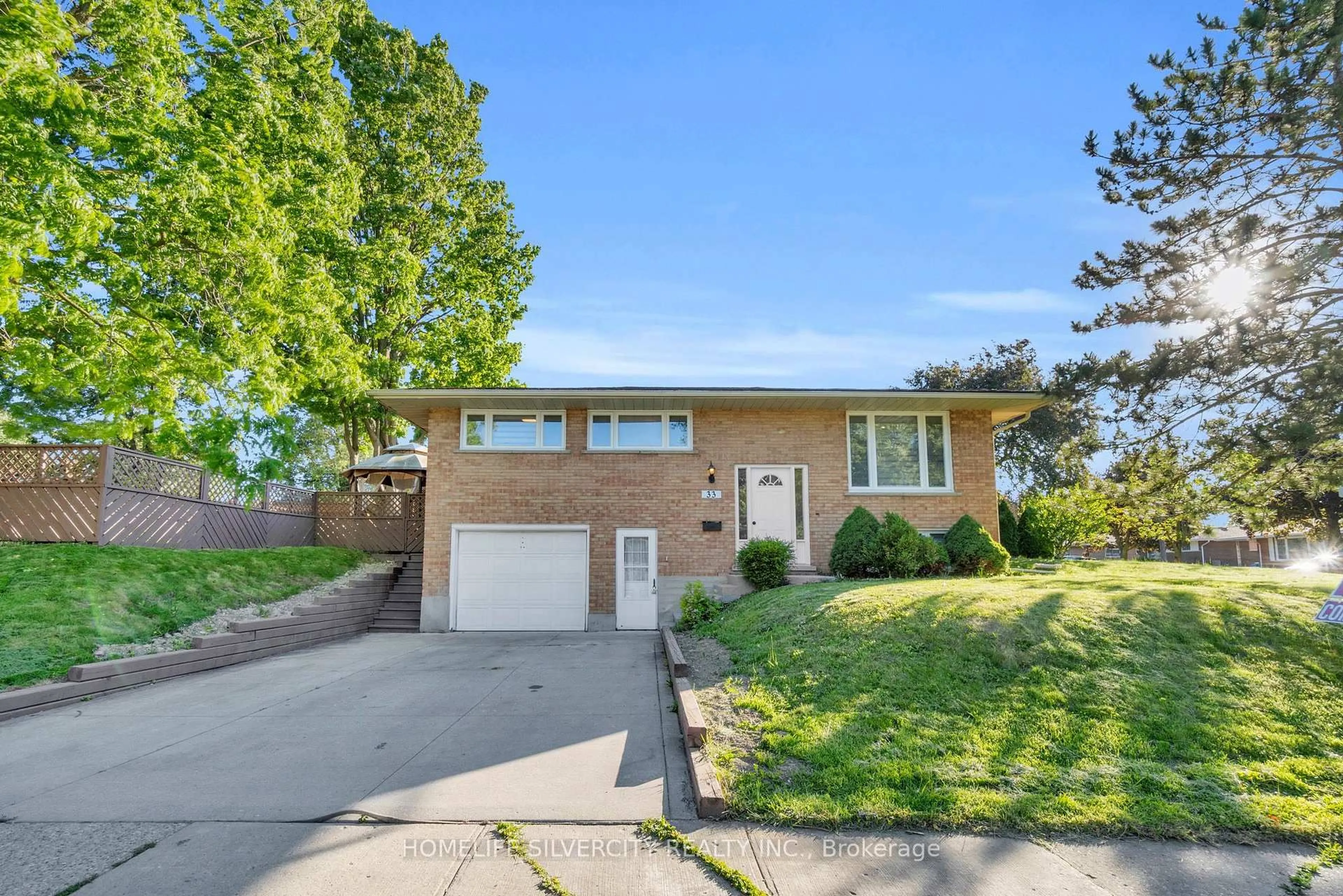 Home with brick exterior material, street for 33 Sweetbriar Dr, Kitchener Ontario N2M 4S4