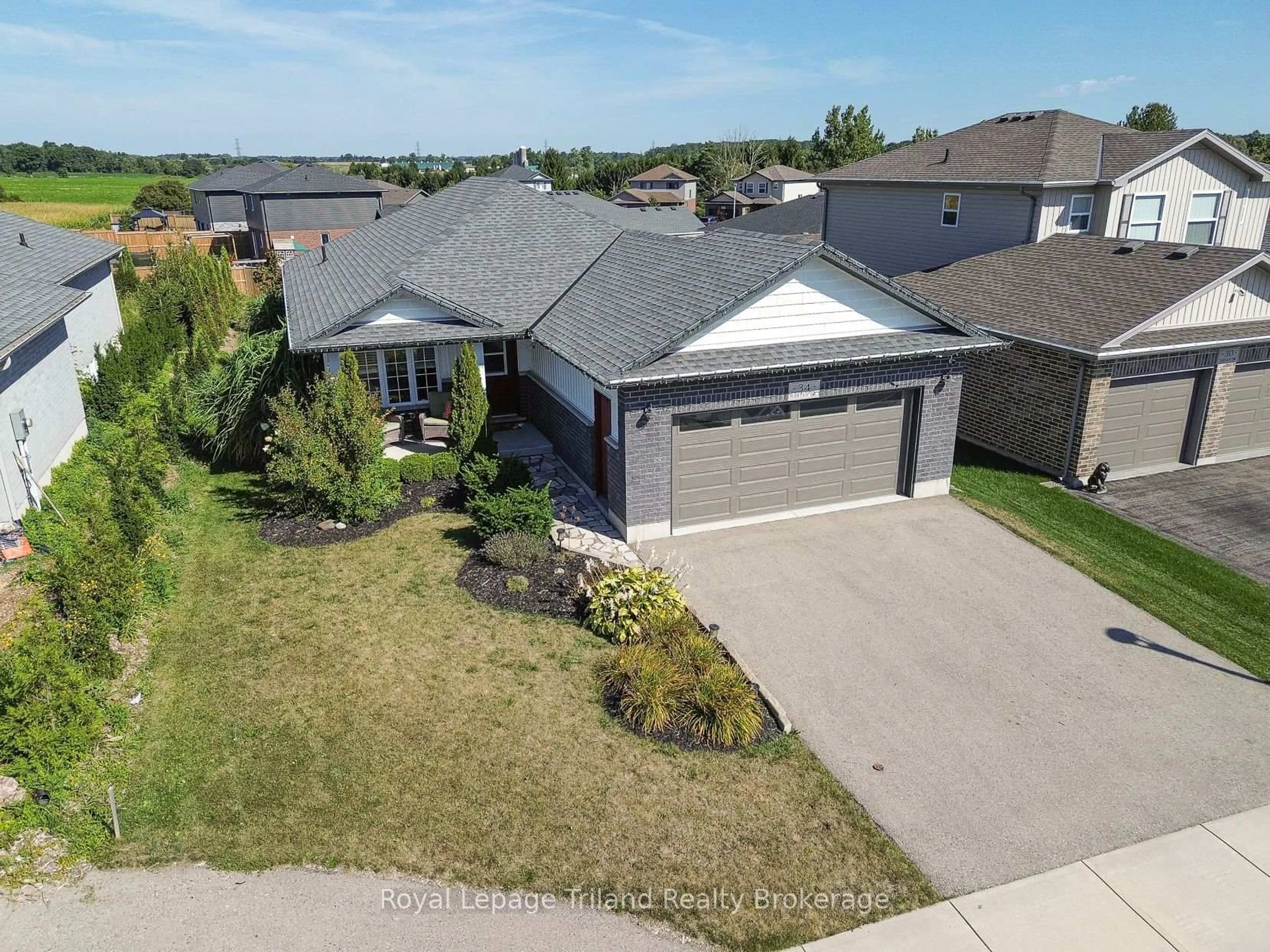 A pic from outside/outdoor area/front of a property/back of a property/a pic from drone, street for 34 Tartan Dr, Zorra Ontario N0J 1J0