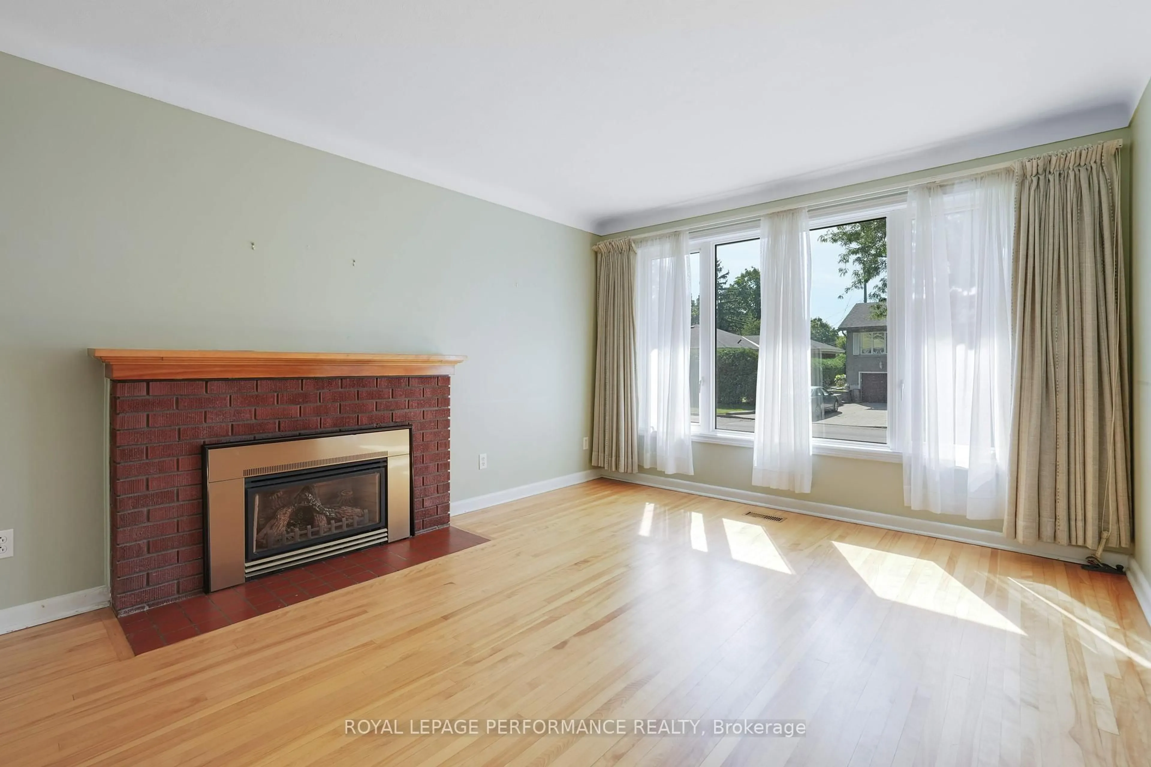 Living room with furniture, wood/laminate floor for 773 Fairdale Ave, Ottawa Ontario K1G 1X6