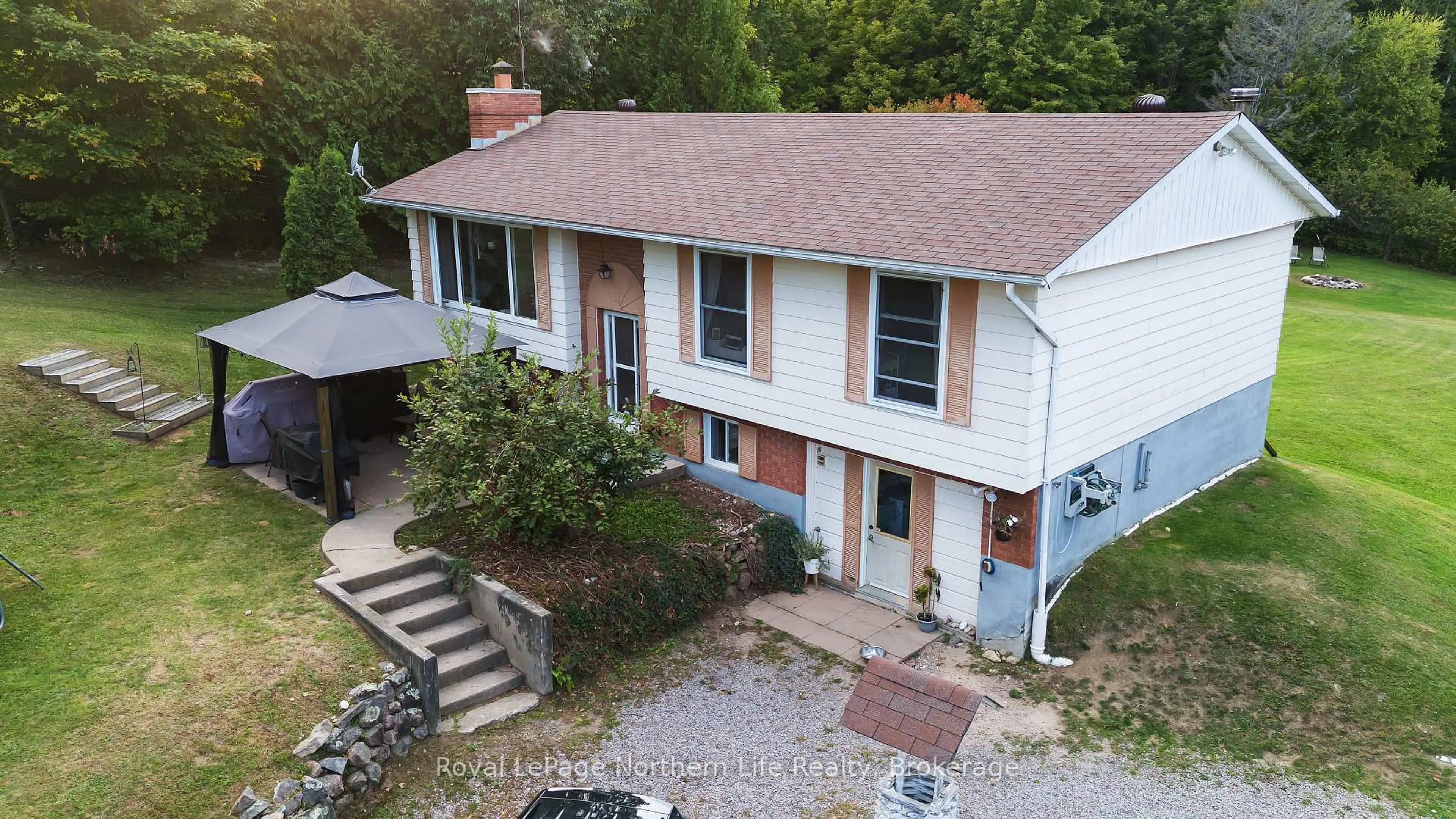 A pic from outside/outdoor area/front of a property/back of a property/a pic from drone, unknown for 103 Development Rd, Bonfield Ontario P0H 1E0