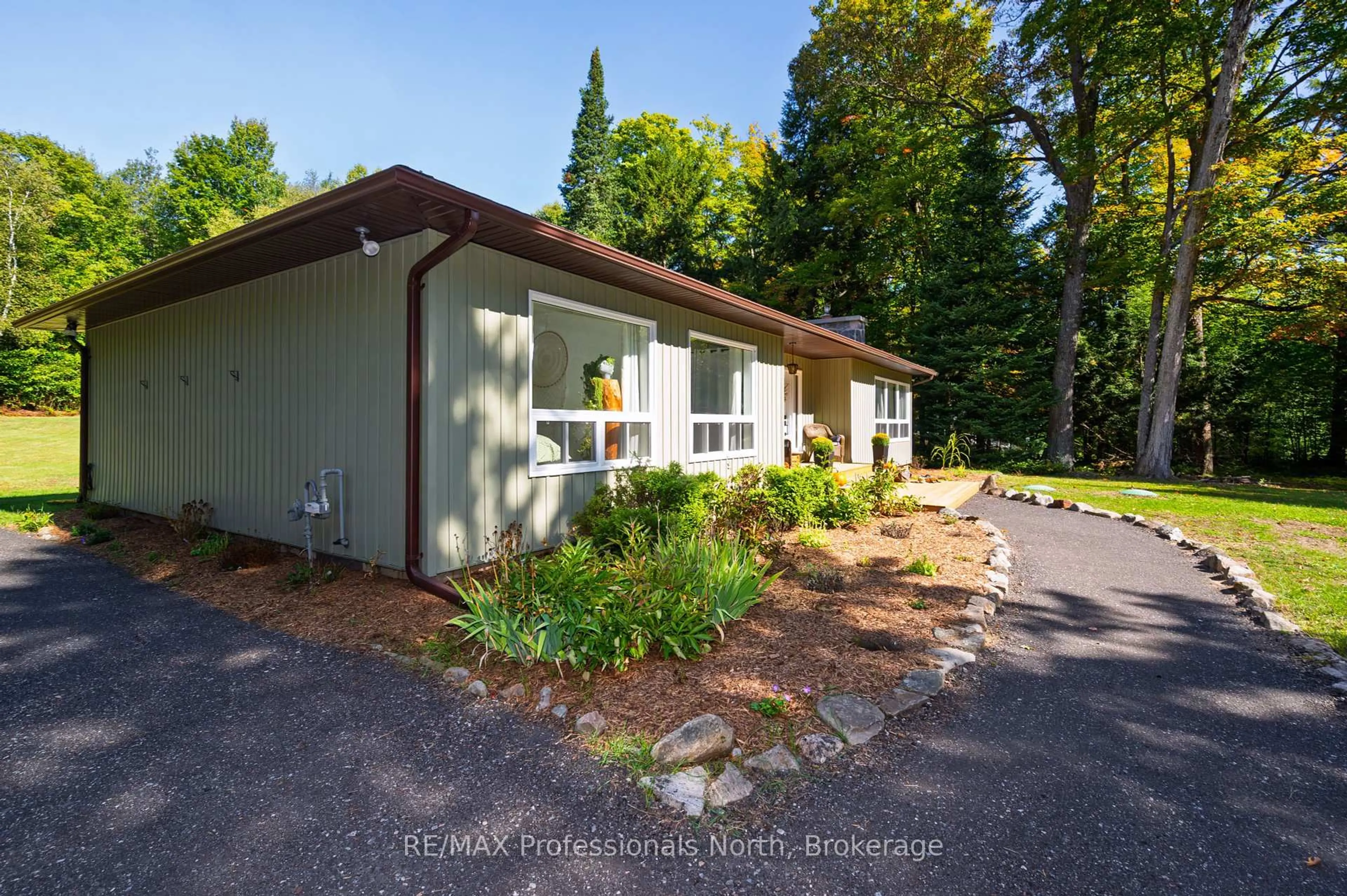 A pic from outside/outdoor area/front of a property/back of a property/a pic from drone, forest/trees view for 106 Ladell Heights Cres, Huntsville Ontario P0B 1L0