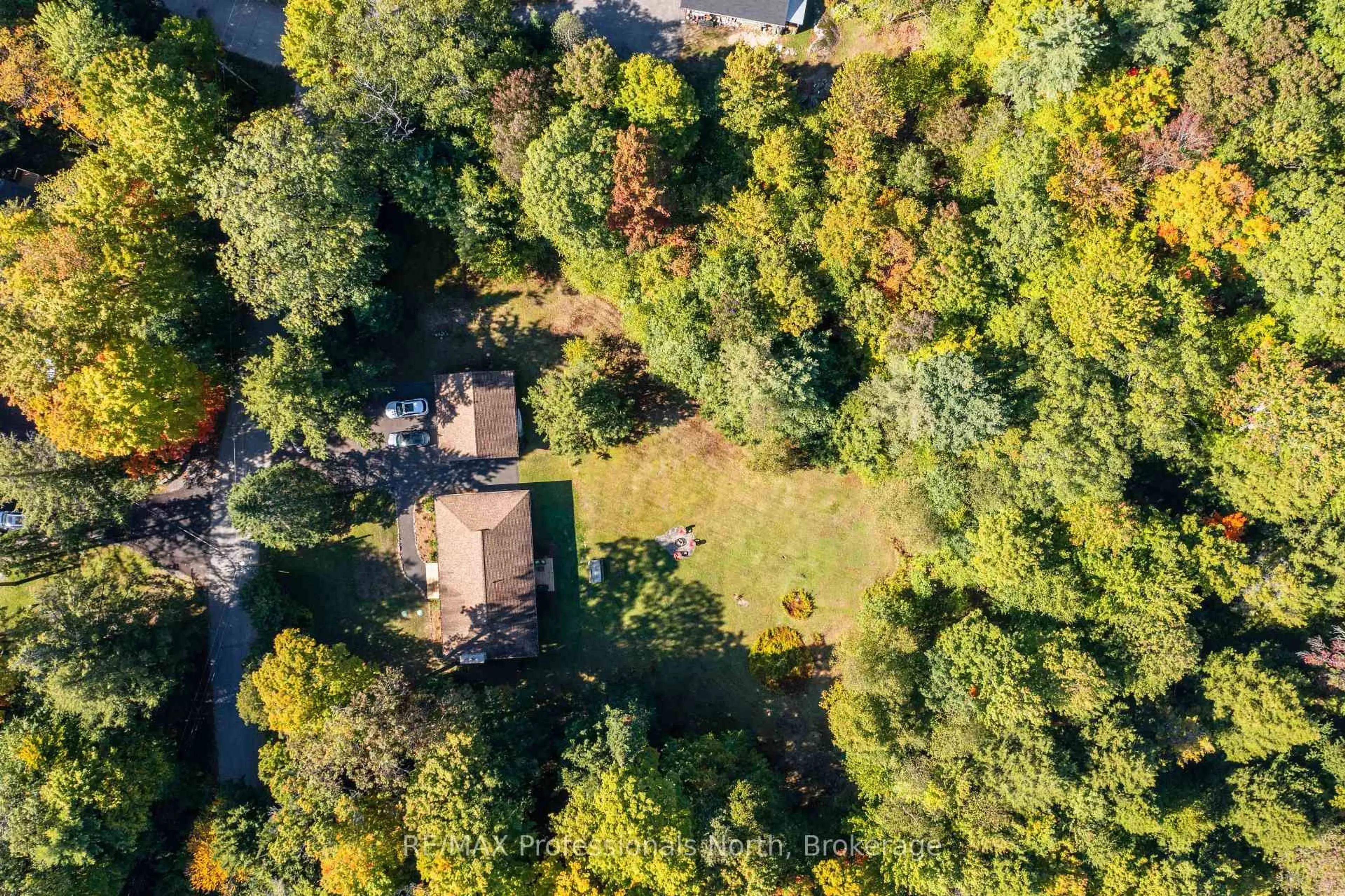 A pic from outside/outdoor area/front of a property/back of a property/a pic from drone, forest/trees view for 106 Ladell Heights Cres, Huntsville Ontario P0B 1L0