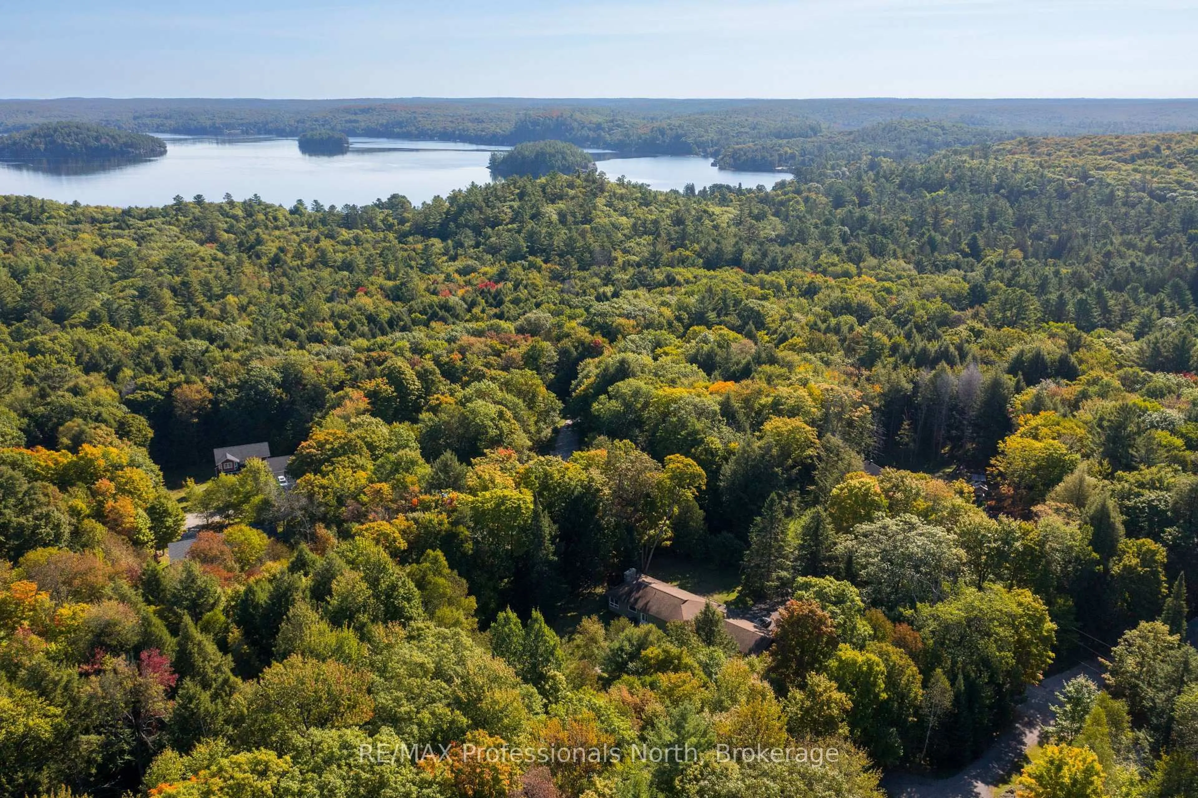 A pic from outside/outdoor area/front of a property/back of a property/a pic from drone, forest/trees view for 106 Ladell Heights Cres, Huntsville Ontario P0B 1L0