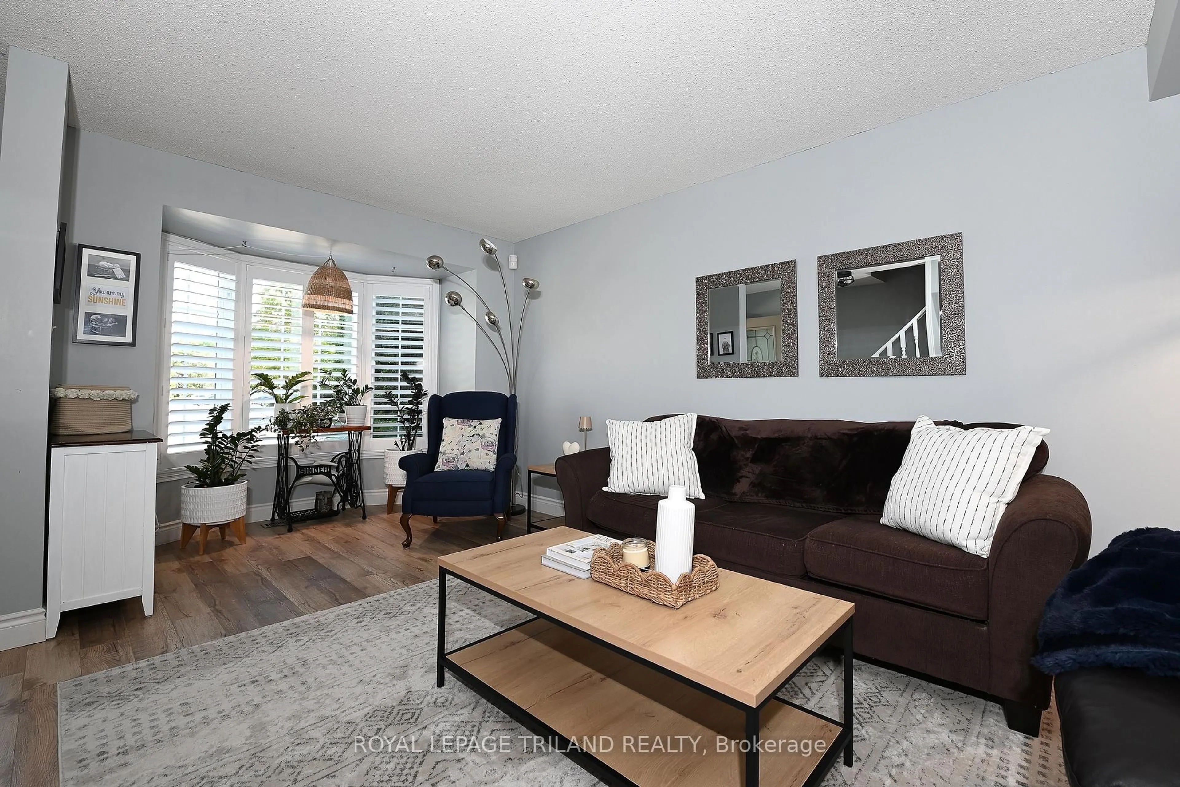 Living room with furniture, wood/laminate floor for 101 Brookside St #21, London South Ontario N5Z 5C9