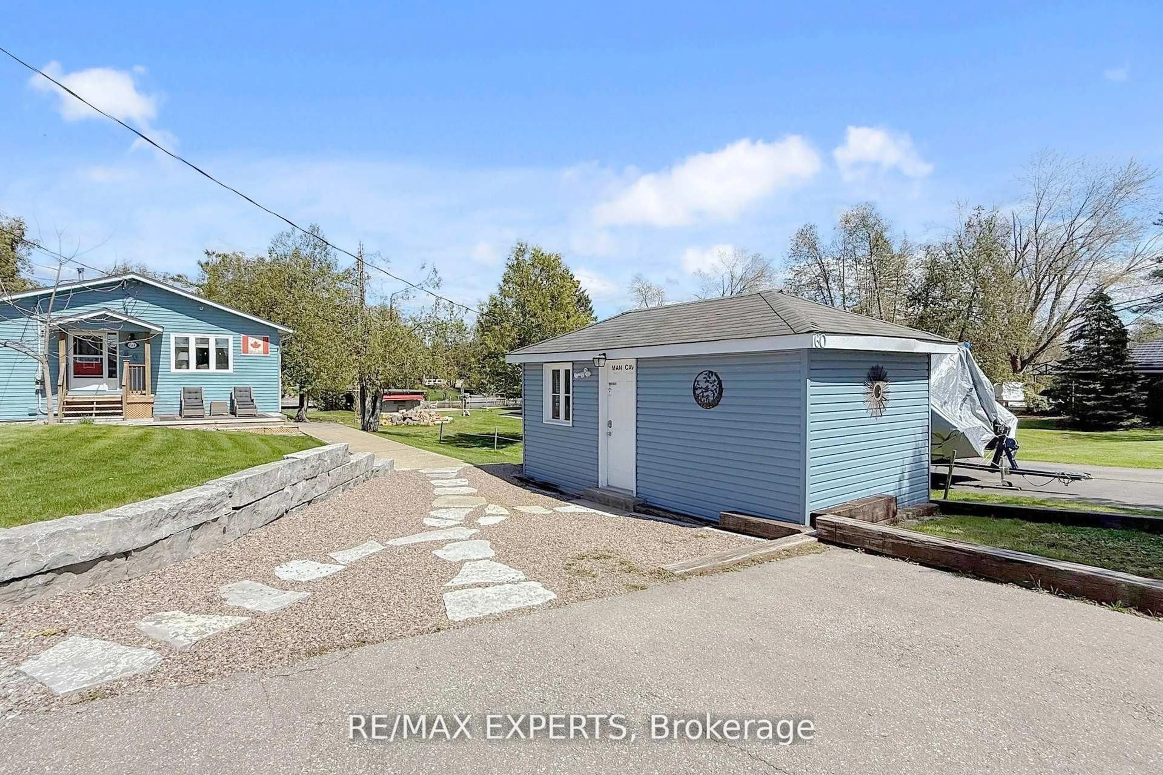A pic from outside/outdoor area/front of a property/back of a property/a pic from drone, street for 60 River Dr, Kawartha Lakes Ontario K0M 1N0