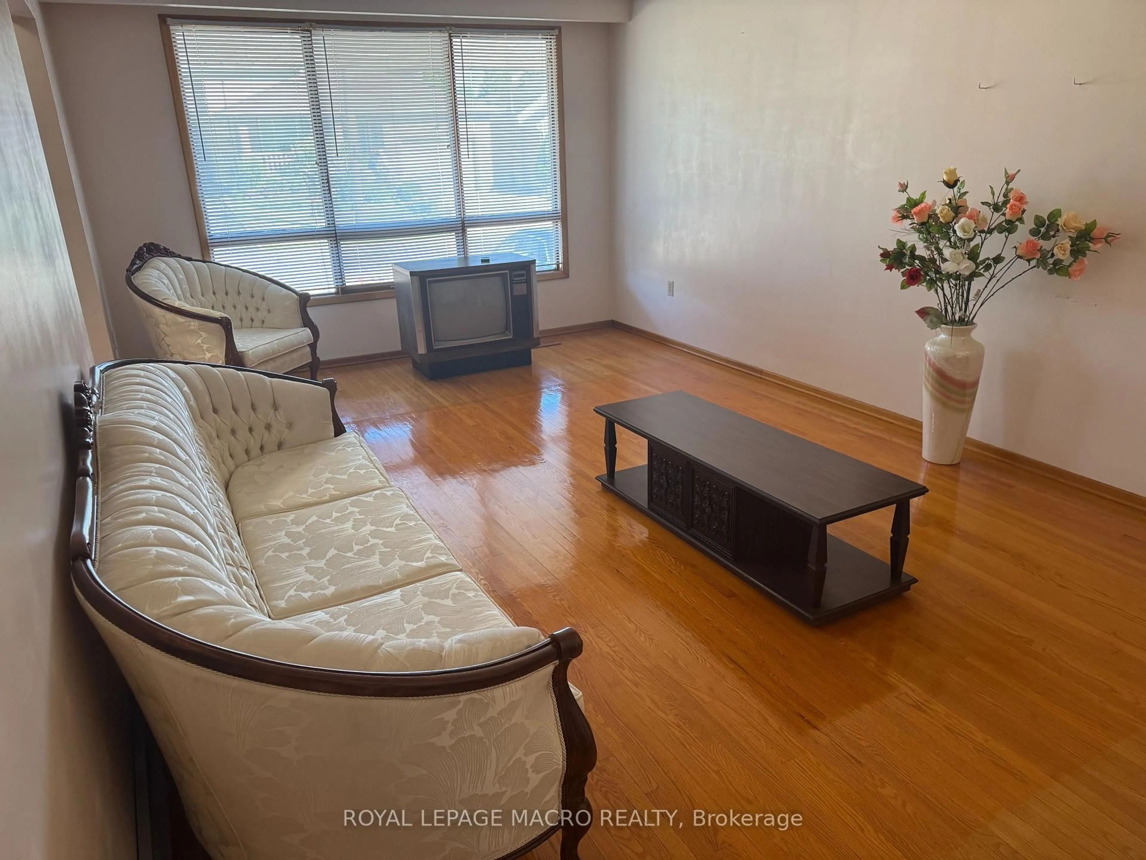 Living room with furniture, wood/laminate floor for 31 Adair Ave, Hamilton Ontario L8H 6A5
