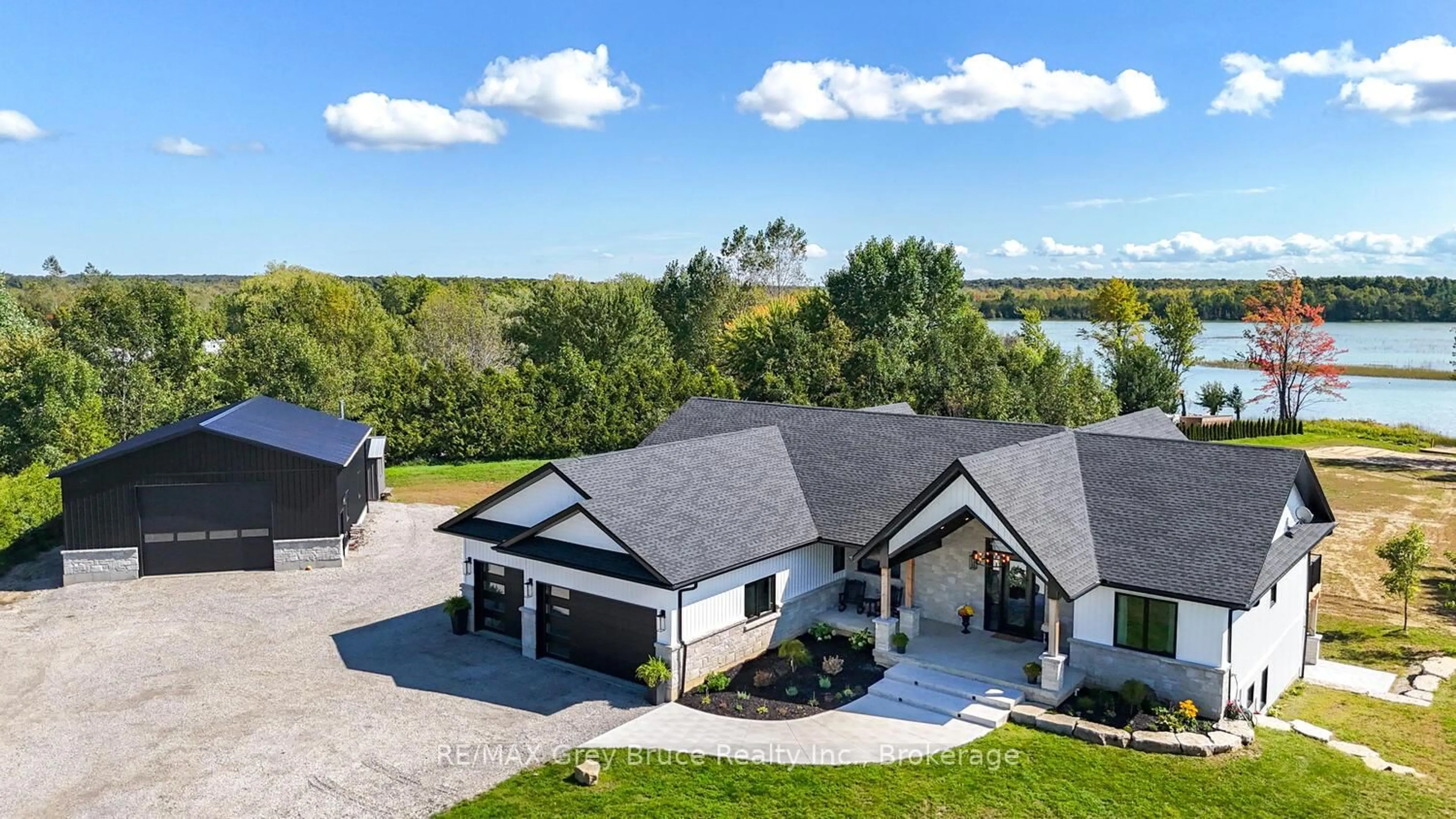 A pic from outside/outdoor area/front of a property/back of a property/a pic from drone, water/lake/river/ocean view for 117 Almur Dr, Georgian Bluffs Ontario N0H 2T0