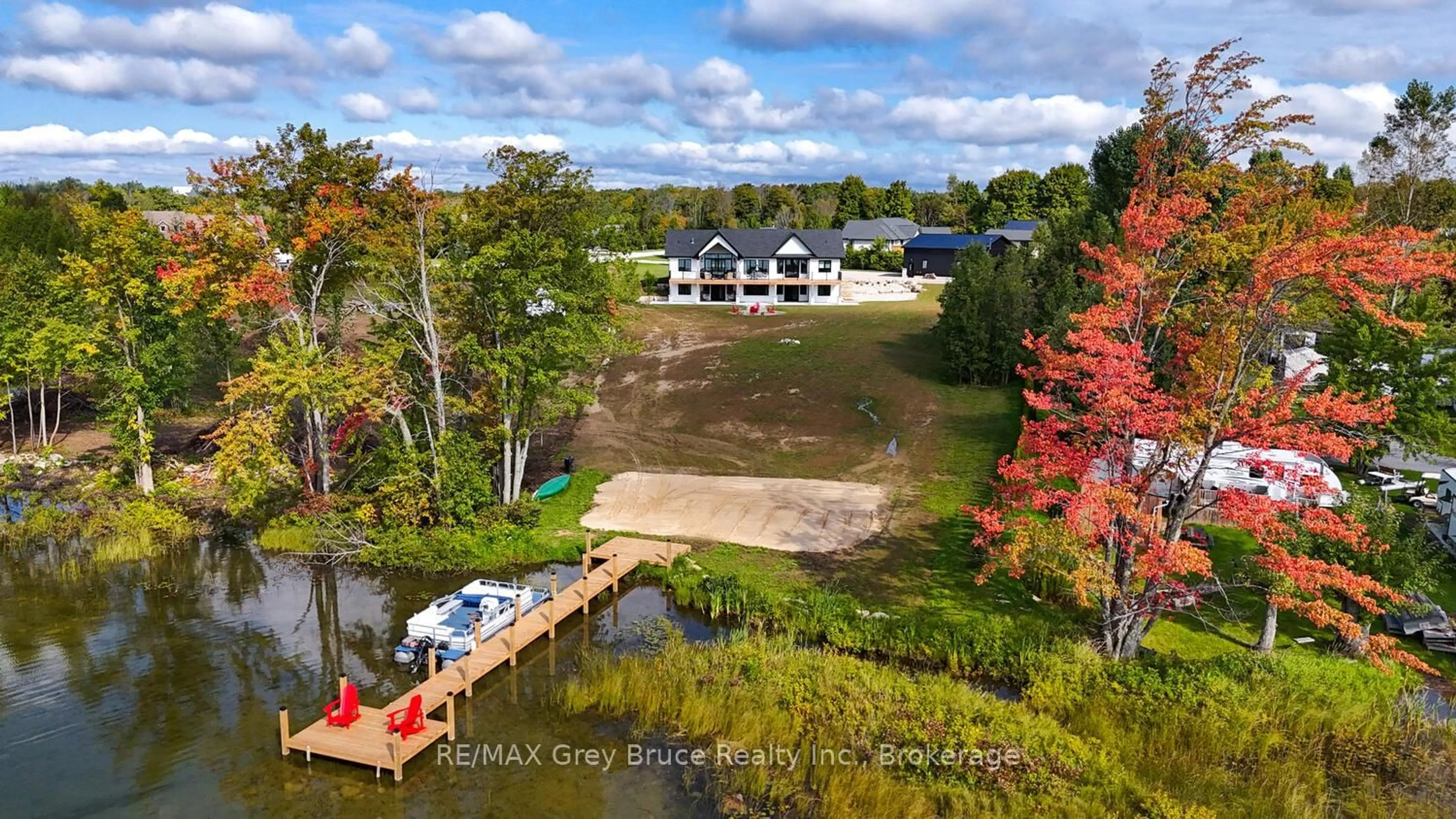 A pic from outside/outdoor area/front of a property/back of a property/a pic from drone, water/lake/river/ocean view for 117 Almur Dr, Georgian Bluffs Ontario N0H 2T0