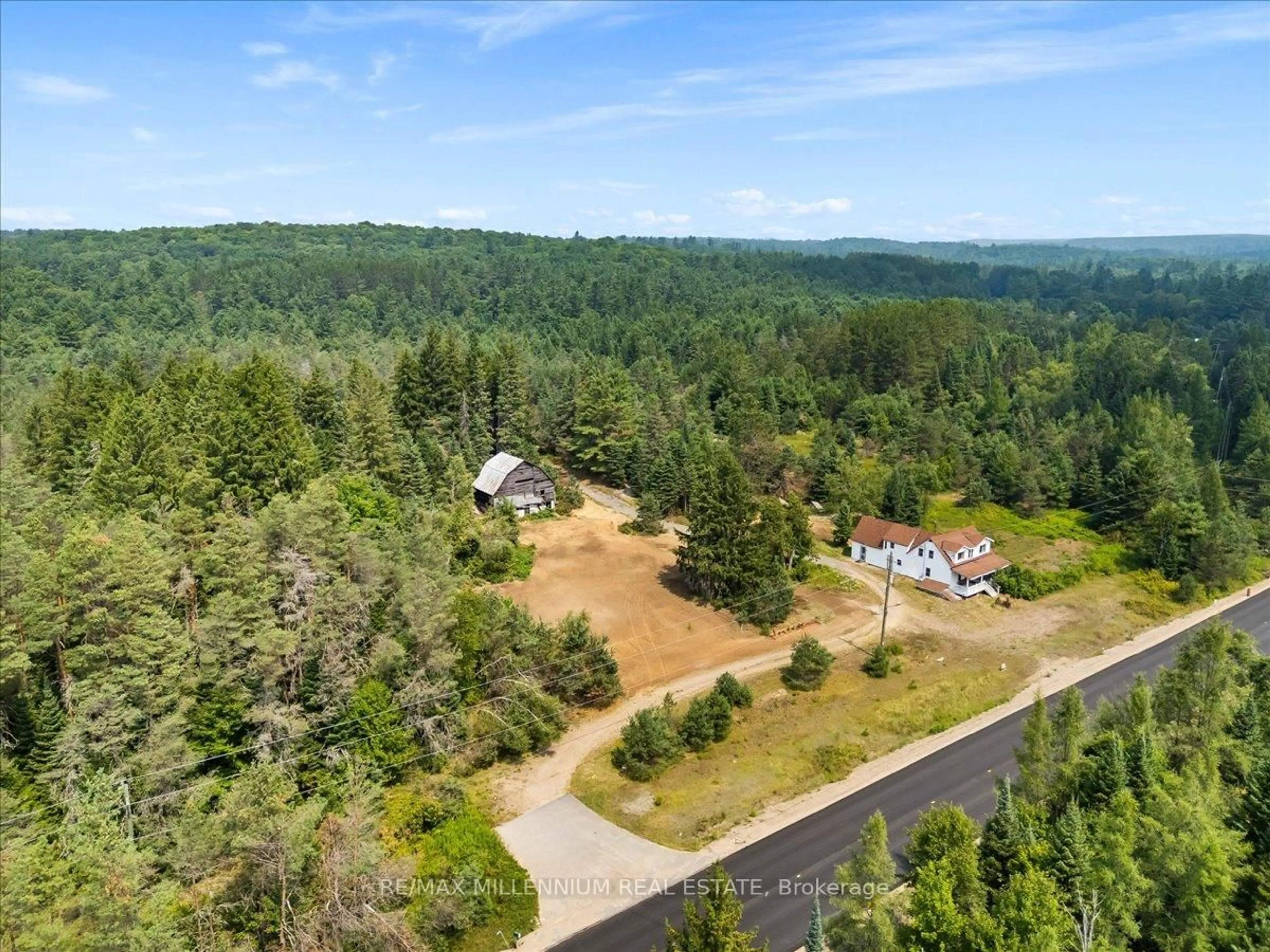 A pic from outside/outdoor area/front of a property/back of a property/a pic from drone, forest/trees view for 3529 Highway Highway #118, Bracebridge Ontario P1L 1X1