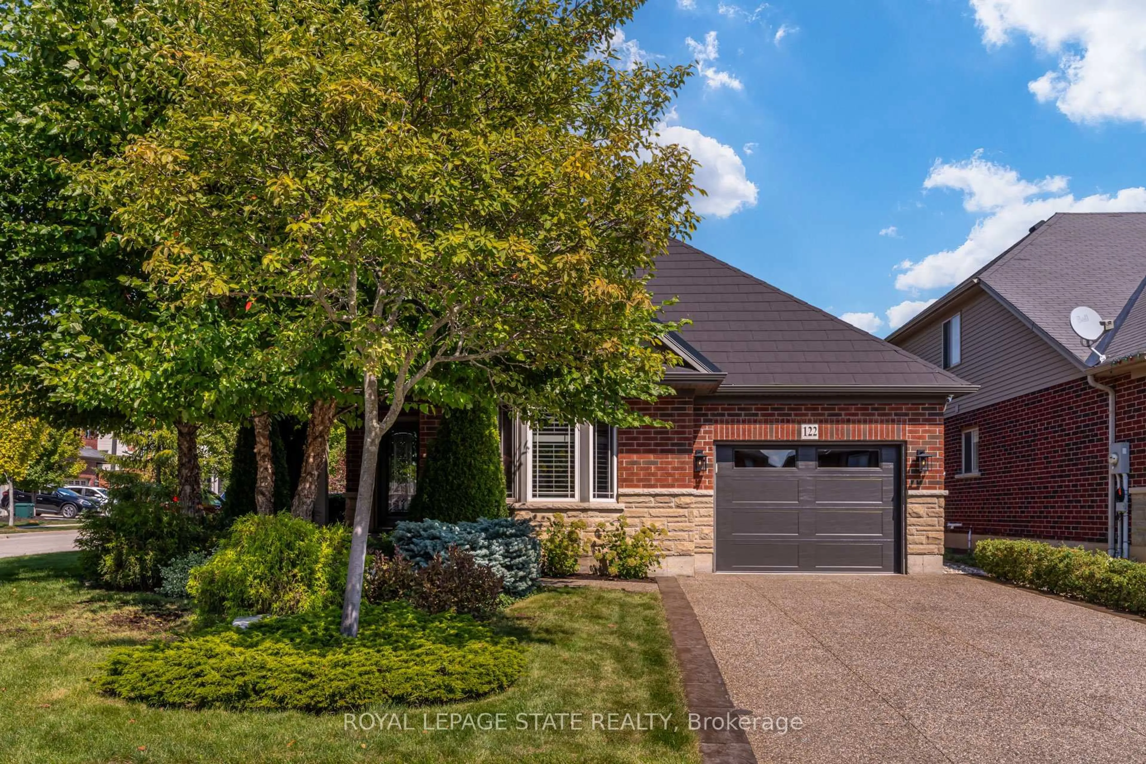 Home with brick exterior material, street for 122 Pumpkin Pass, Hamilton Ontario L0R 1C0