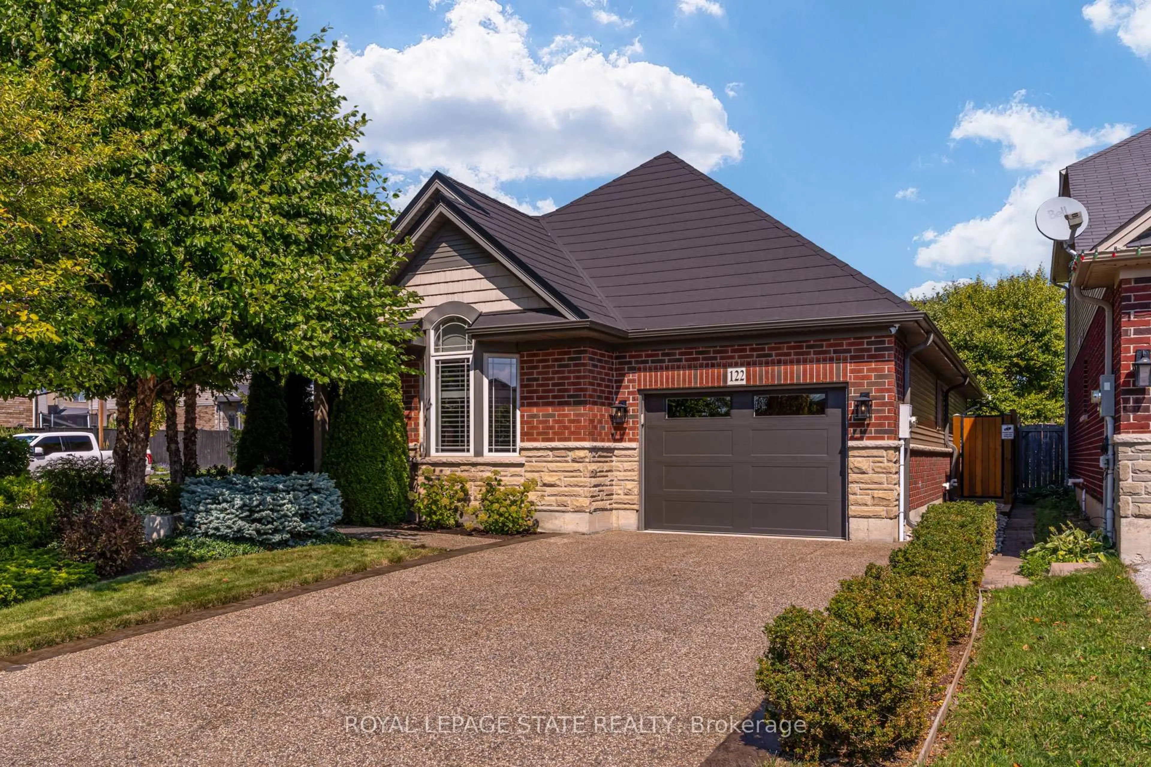 Home with brick exterior material, street for 122 Pumpkin Pass, Hamilton Ontario L0R 1C0