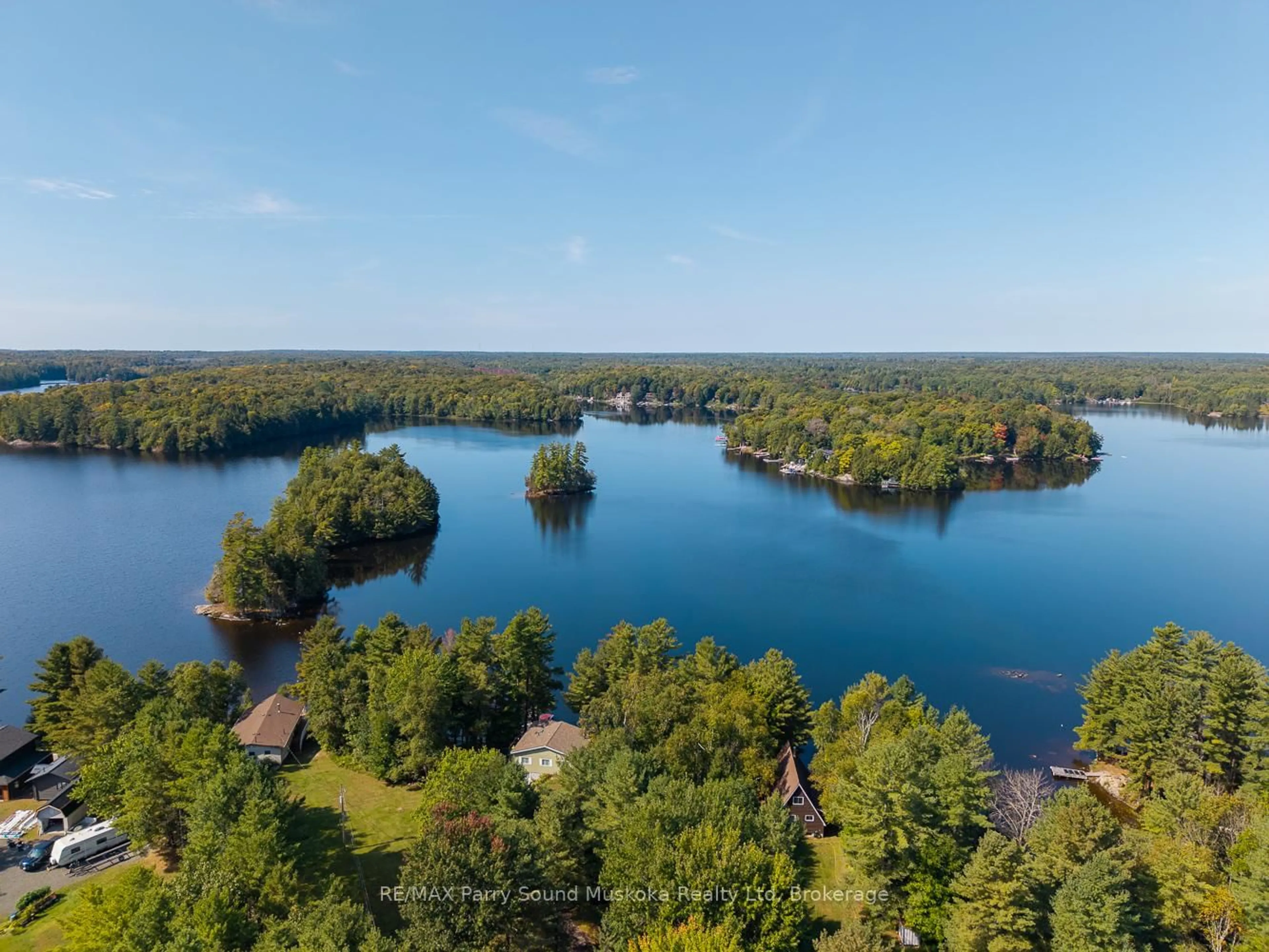 A pic from outside/outdoor area/front of a property/back of a property/a pic from drone, water/lake/river/ocean view for 8 Marine Dr, McKellar Ontario P2A 0B4