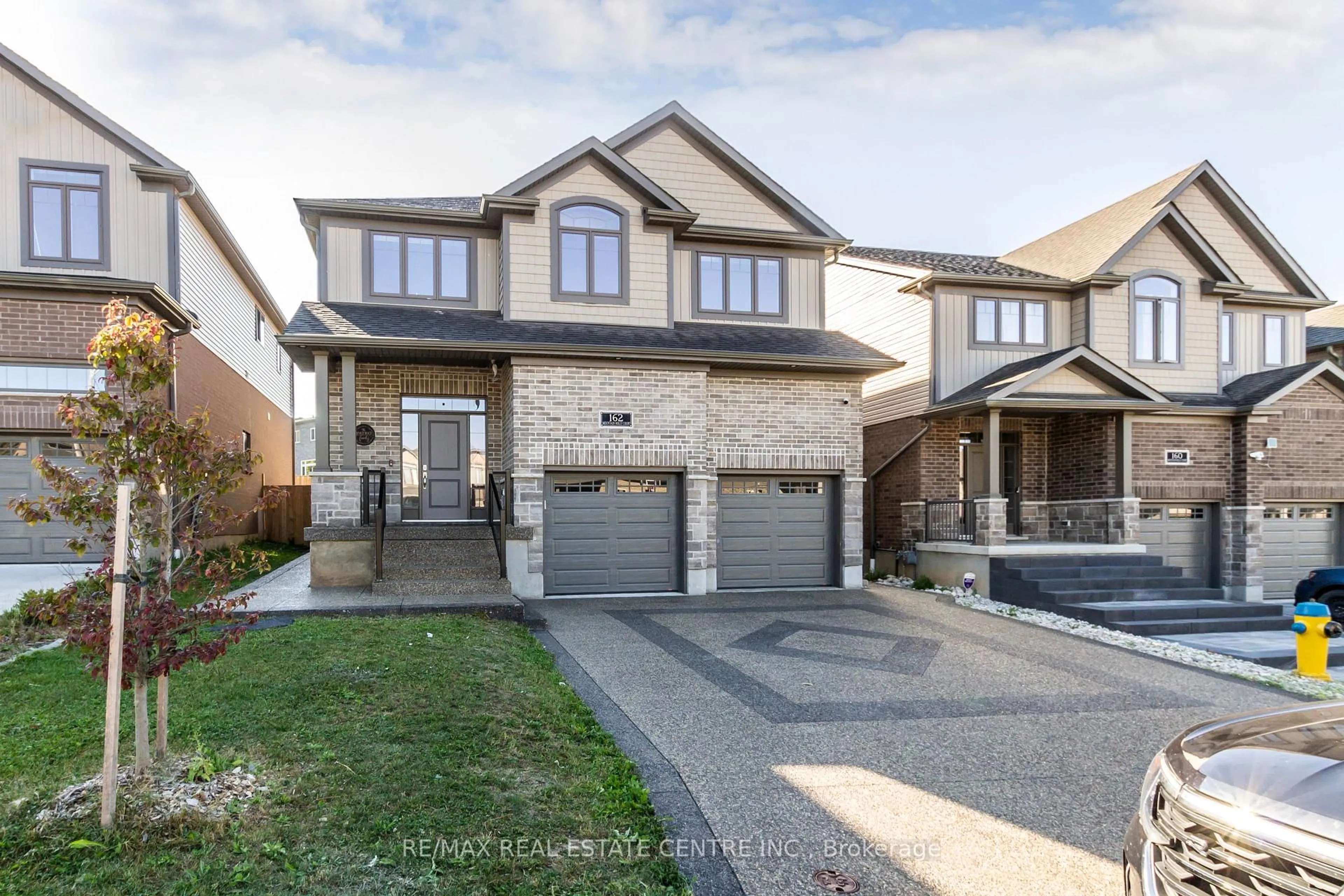 Home with brick exterior material, street for 162 Mountain Holly Crt, Waterloo Ontario N2V 0E1