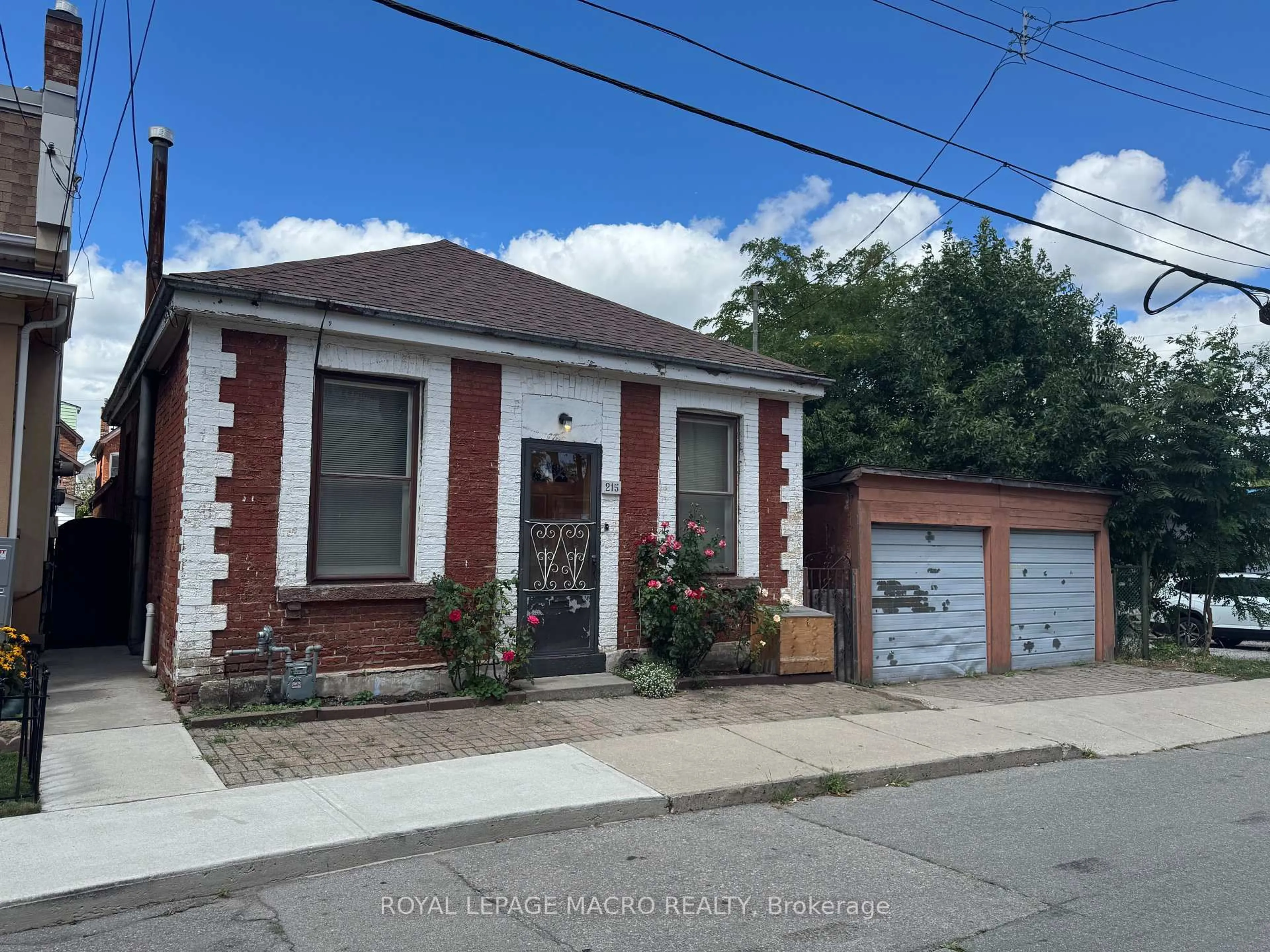 Home with brick exterior material, street for 215 Ray St, Hamilton Ontario L8R 2Y3