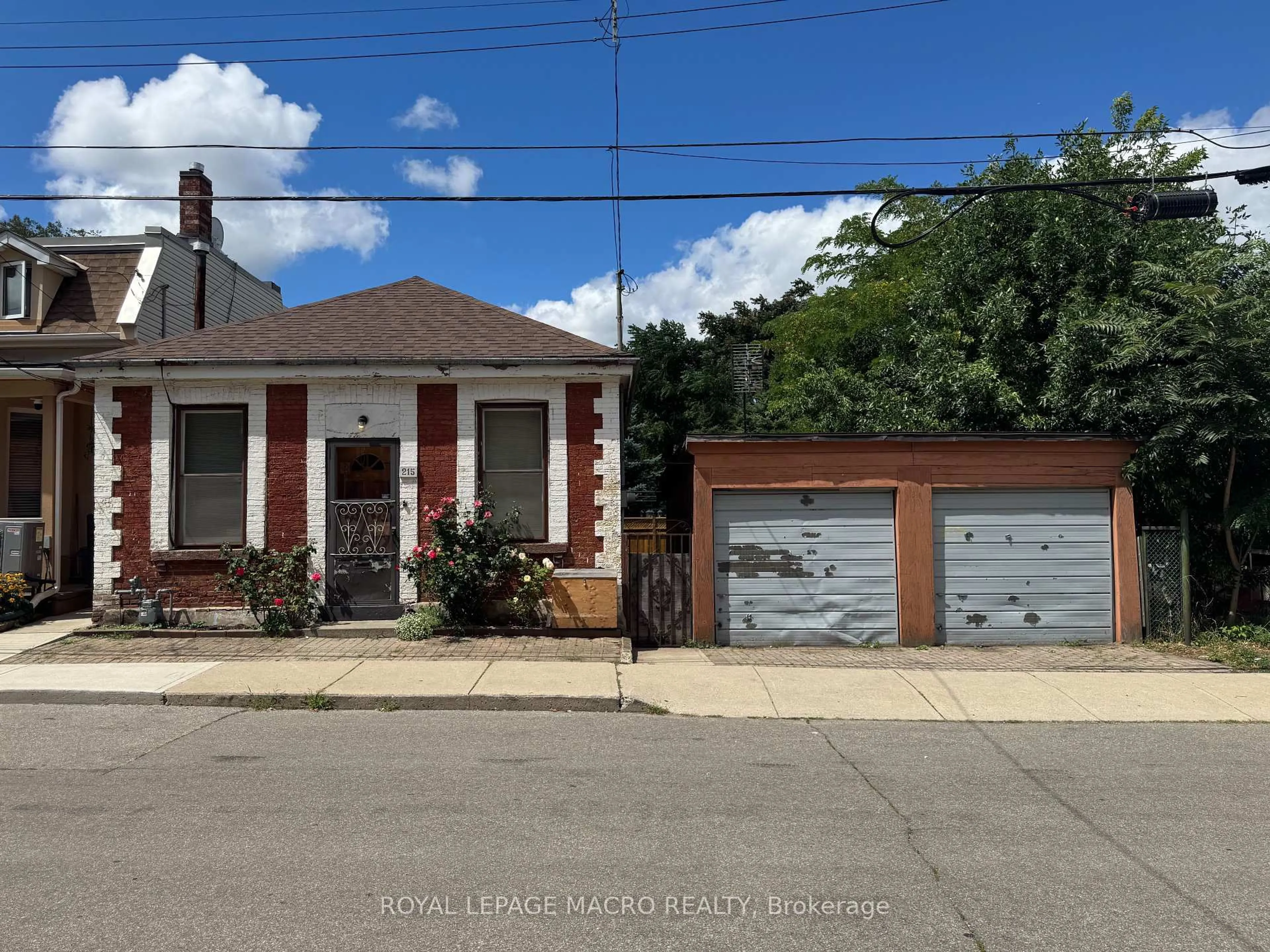 Home with brick exterior material, street for 215 Ray St, Hamilton Ontario L8R 2Y3