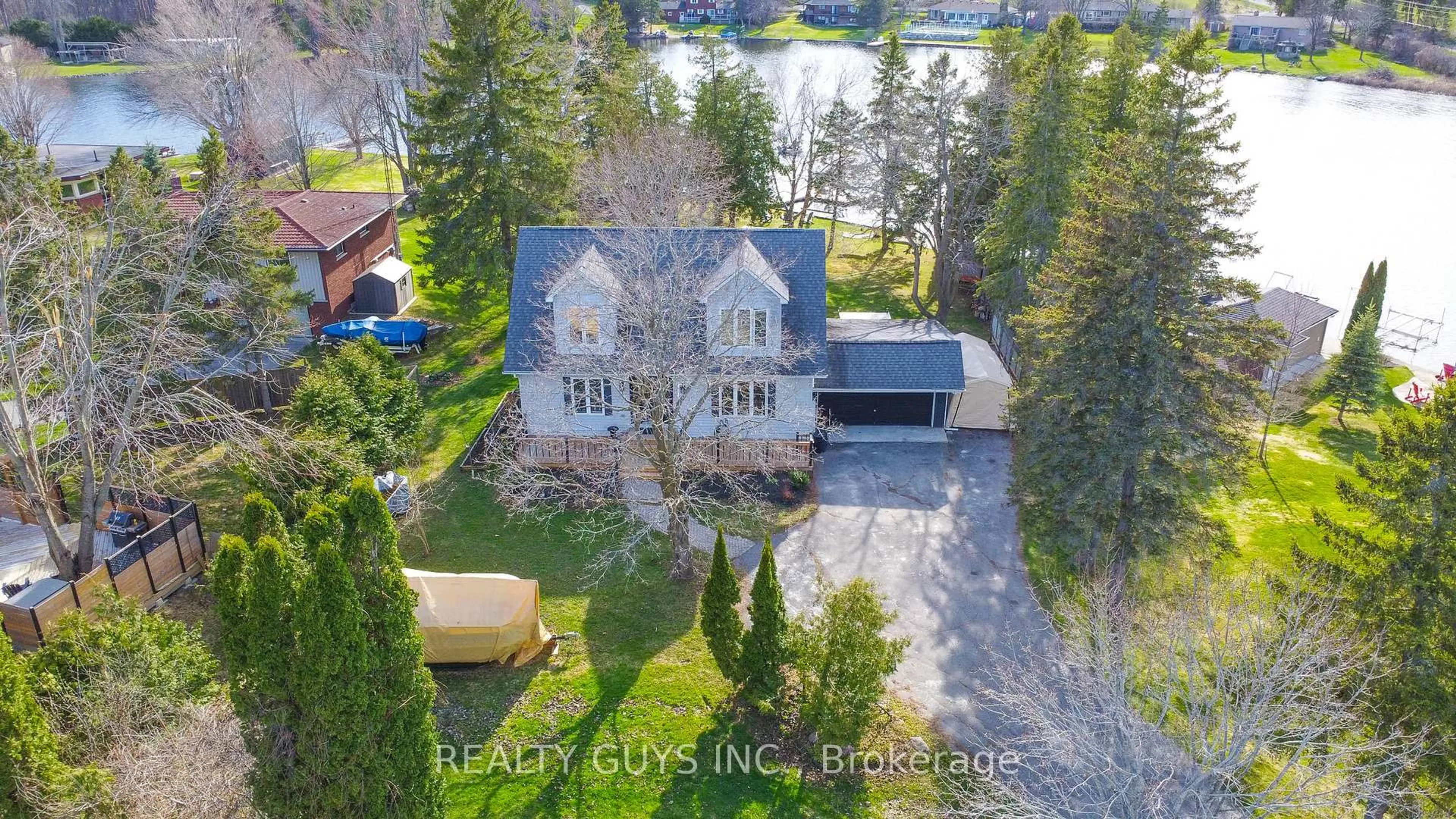 A pic from outside/outdoor area/front of a property/back of a property/a pic from drone, water/lake/river/ocean view for 867 Twomey Pl, Selwyn Ontario K0L 1T0