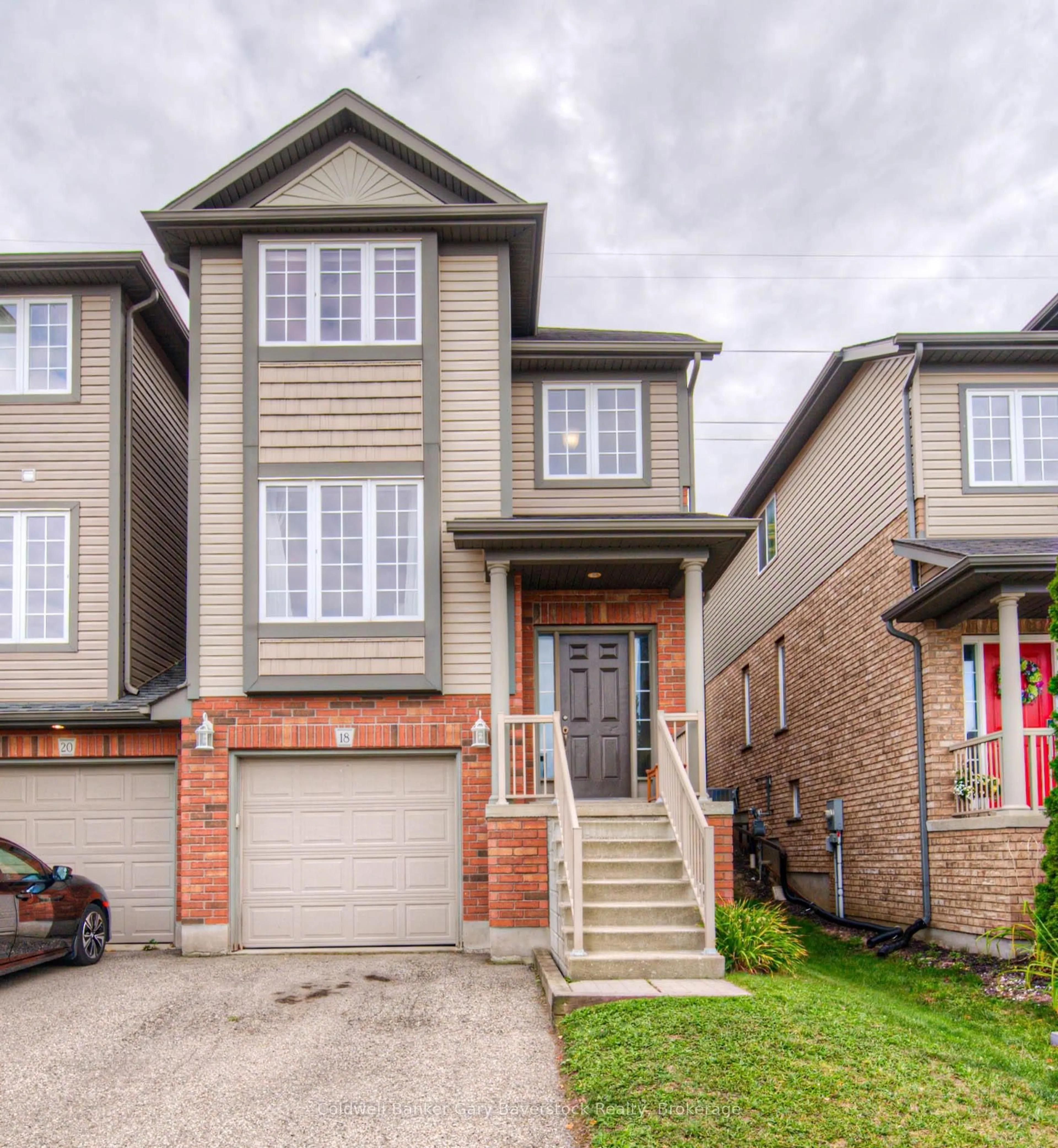 Home with brick exterior material, street for 18 Cranshaw St, Kitchener Ontario N2R 1W2