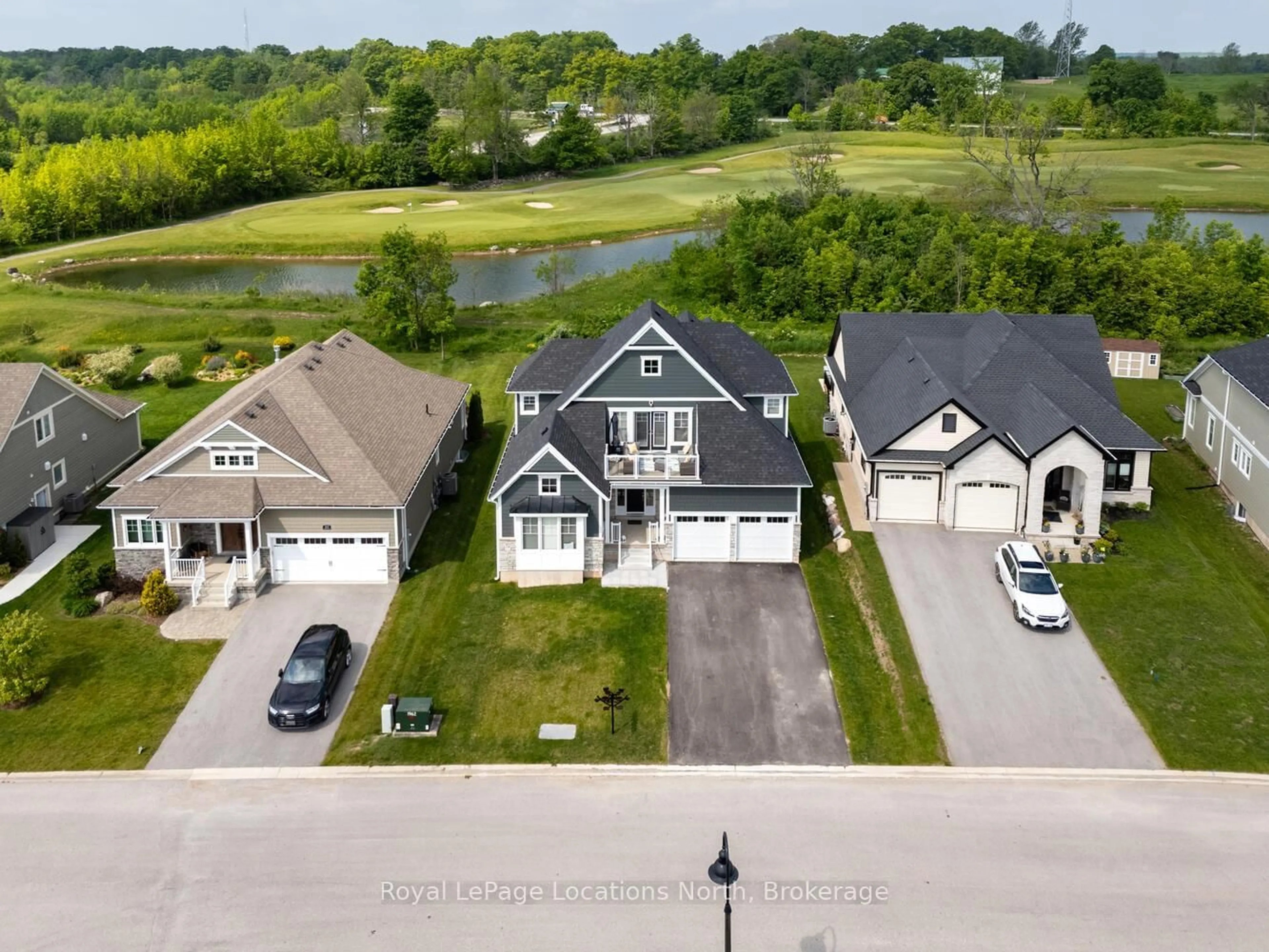 A pic from outside/outdoor area/front of a property/back of a property/a pic from drone, street for 216 Snowberry Lane, Georgian Bluffs Ontario N0H 1S0