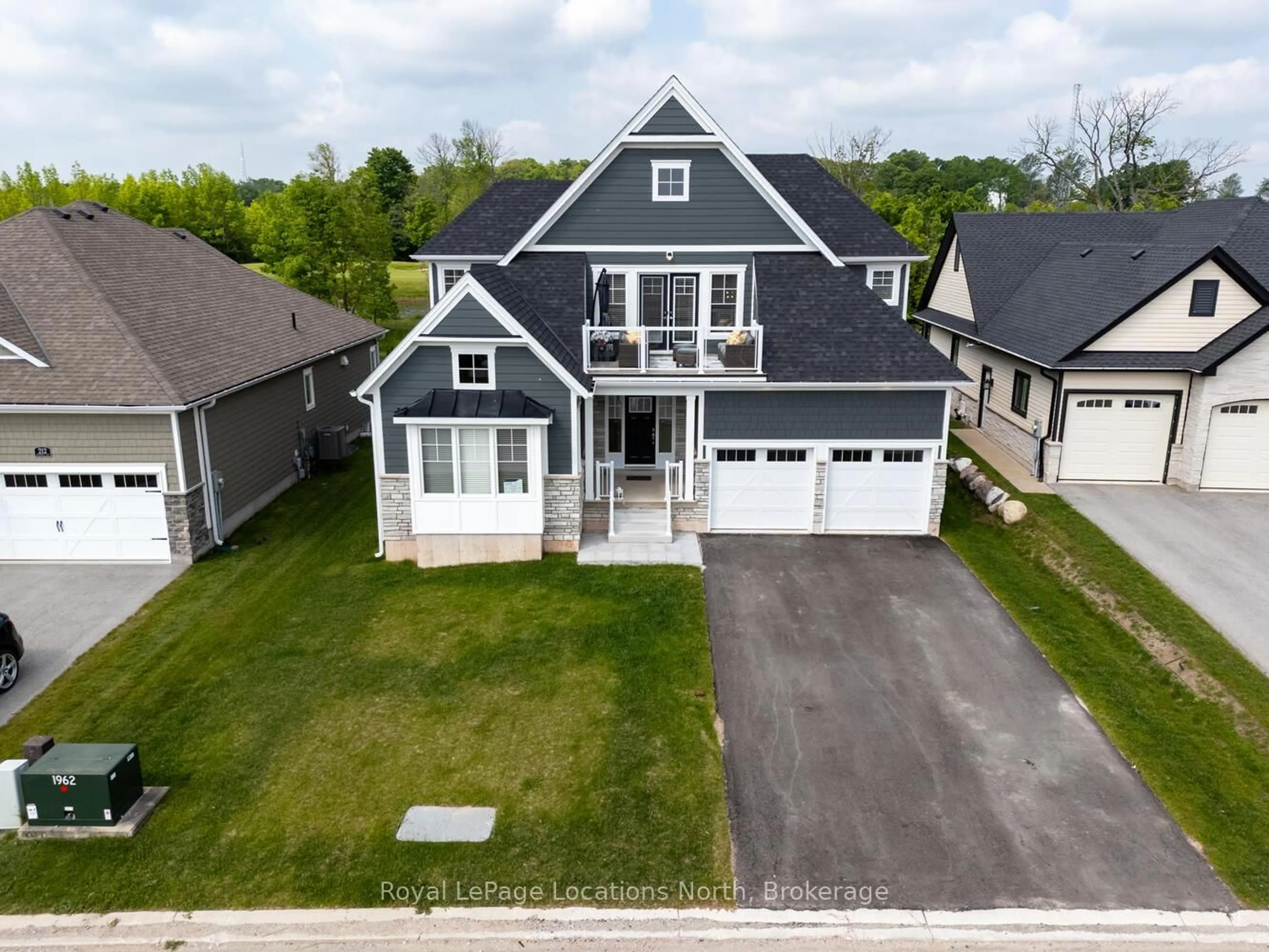 A pic from outside/outdoor area/front of a property/back of a property/a pic from drone, street for 216 Snowberry Lane, Georgian Bluffs Ontario N0H 1S0