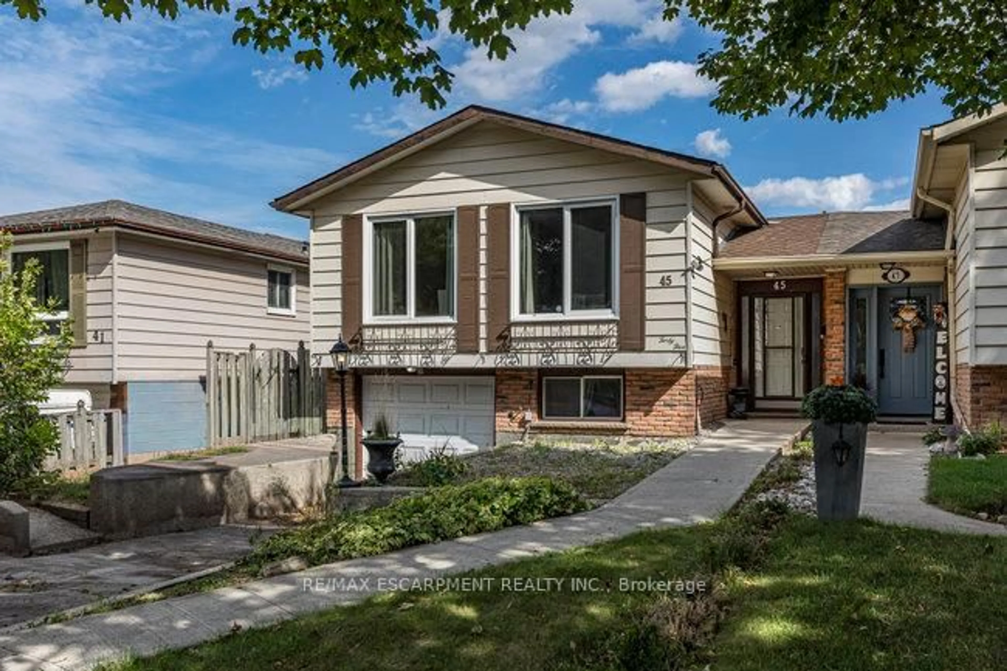 Home with vinyl exterior material, street for 45 Fonthill Rd, Hamilton Ontario L9C 6A1