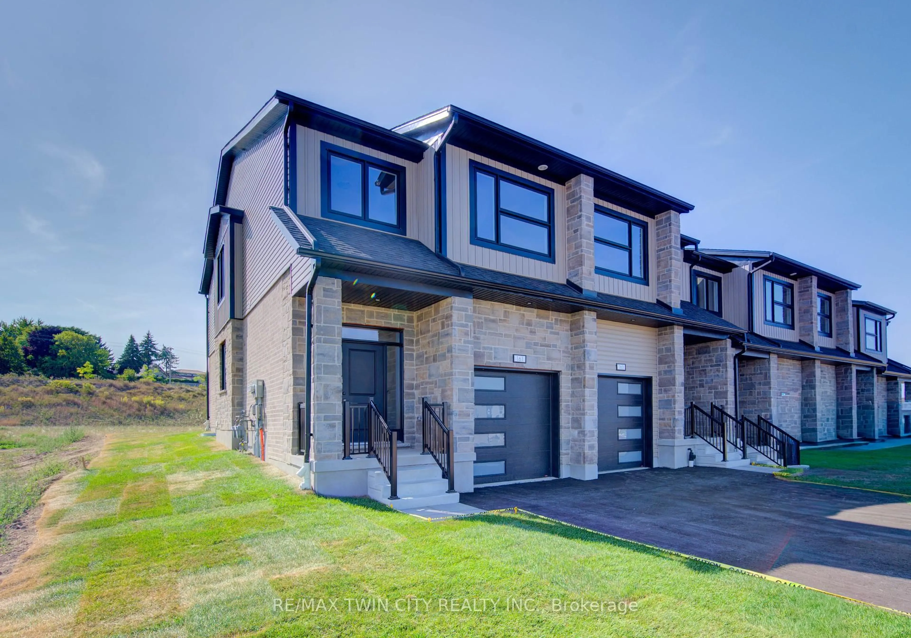 Home with brick exterior material, street for 161 Dunnigan Dr, Kitchener Ontario N2B 0B1