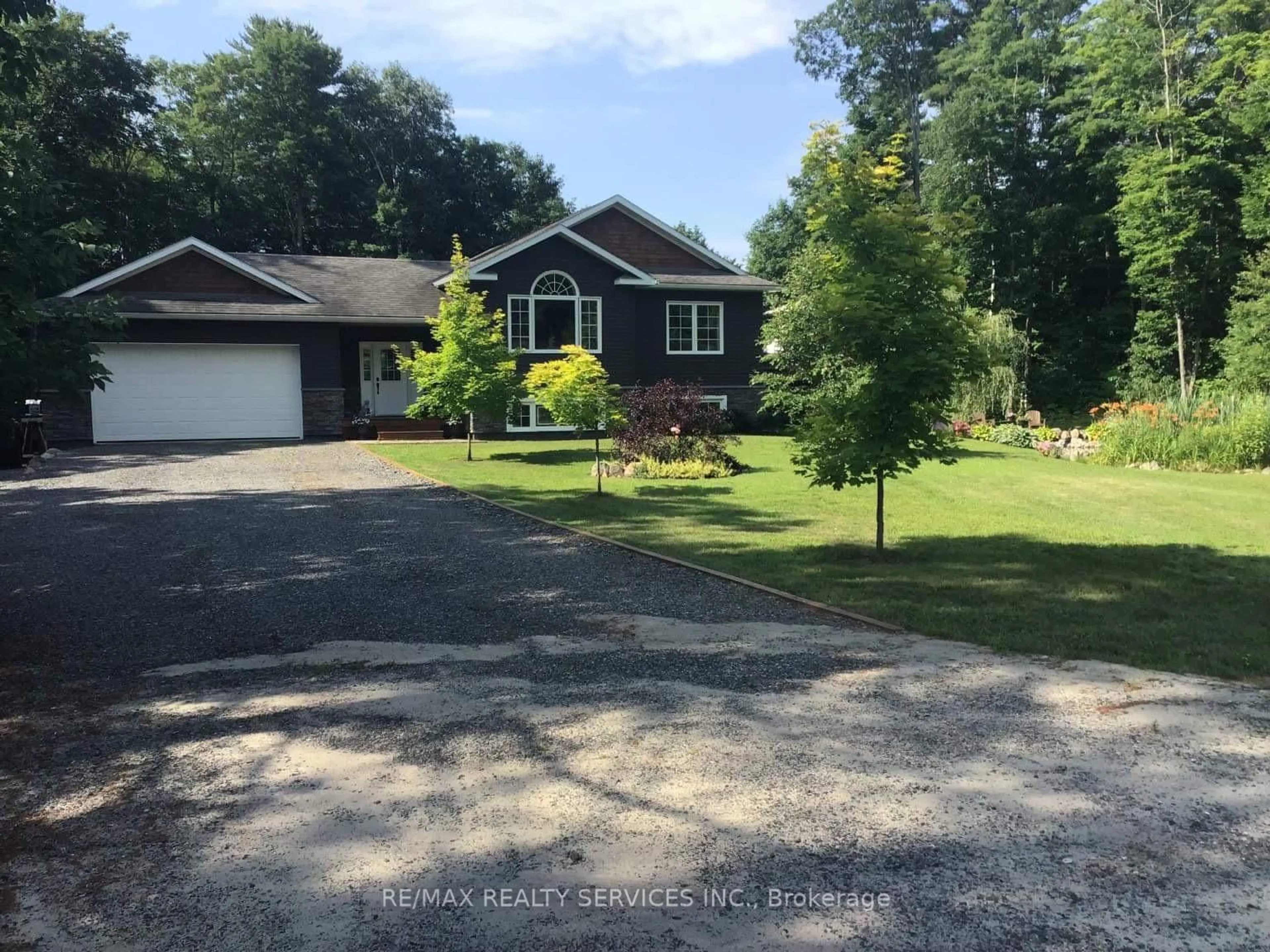 A pic from outside/outdoor area/front of a property/back of a property/a pic from drone, street for 301 Rankin Lake Rd, Seguin Ontario P2A 0B7
